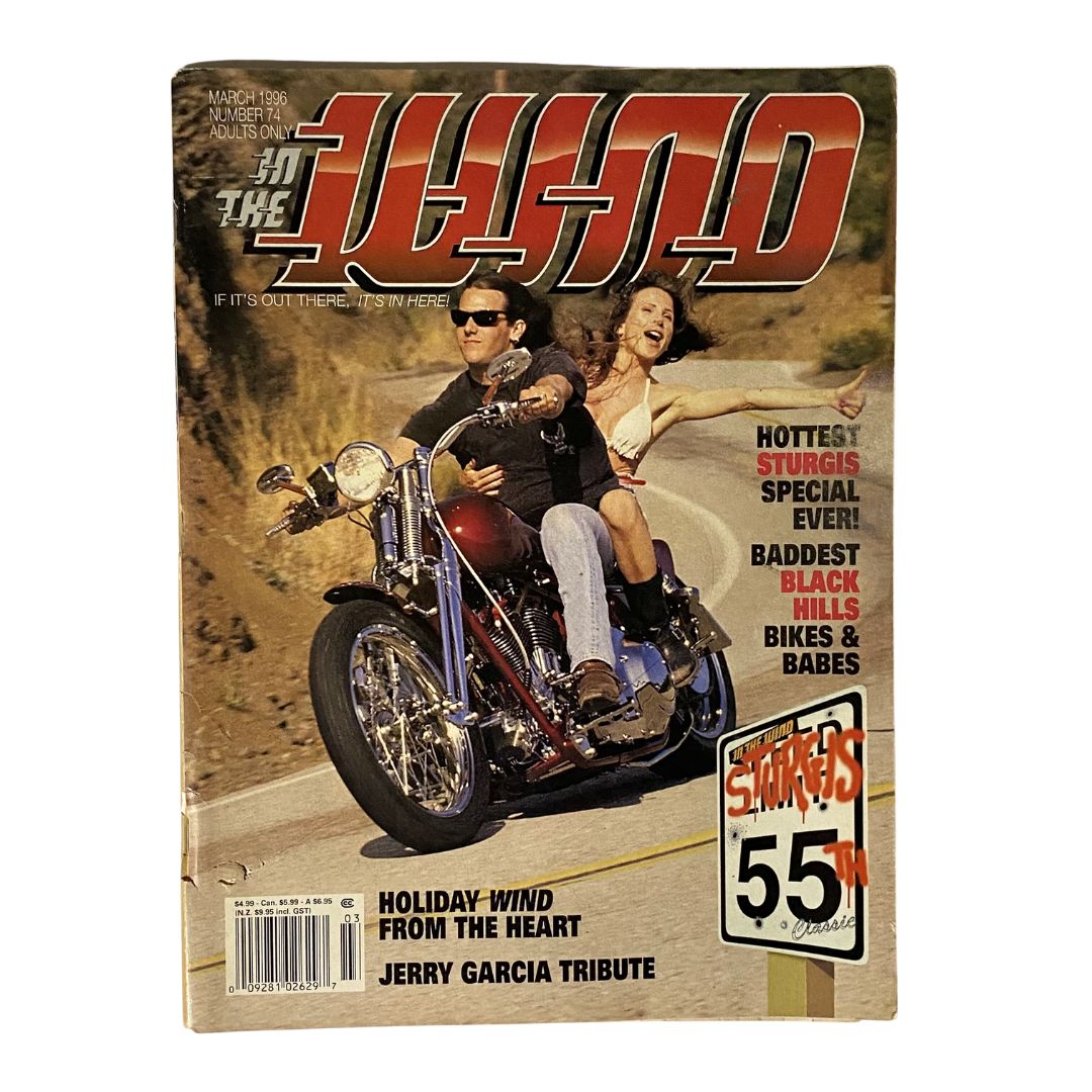 Cover of In The Wind Magazine March 1996 No. 74 featuring a Jerry Garcia tribute, showcasing a vintage motorcycle with a couple riding on a winding road. The magazine includes headlines related to Sturgis and motorcycle culture.