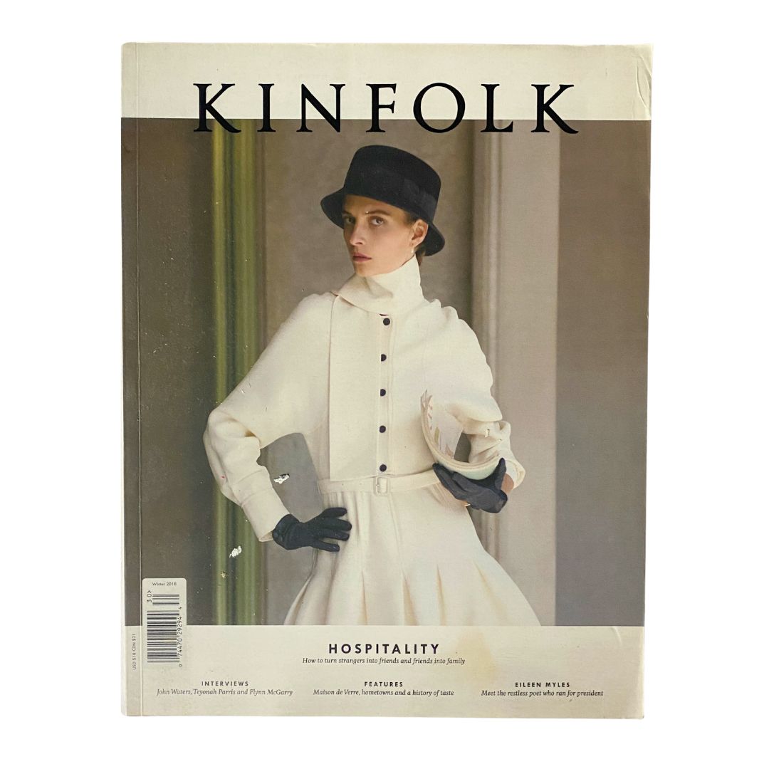 Kinfolk 30 Book by Kinfolk Magazine Winter 2018 - Cover featuring a model in a stylish outfit and a hat, in a sophisticated indoor setting.