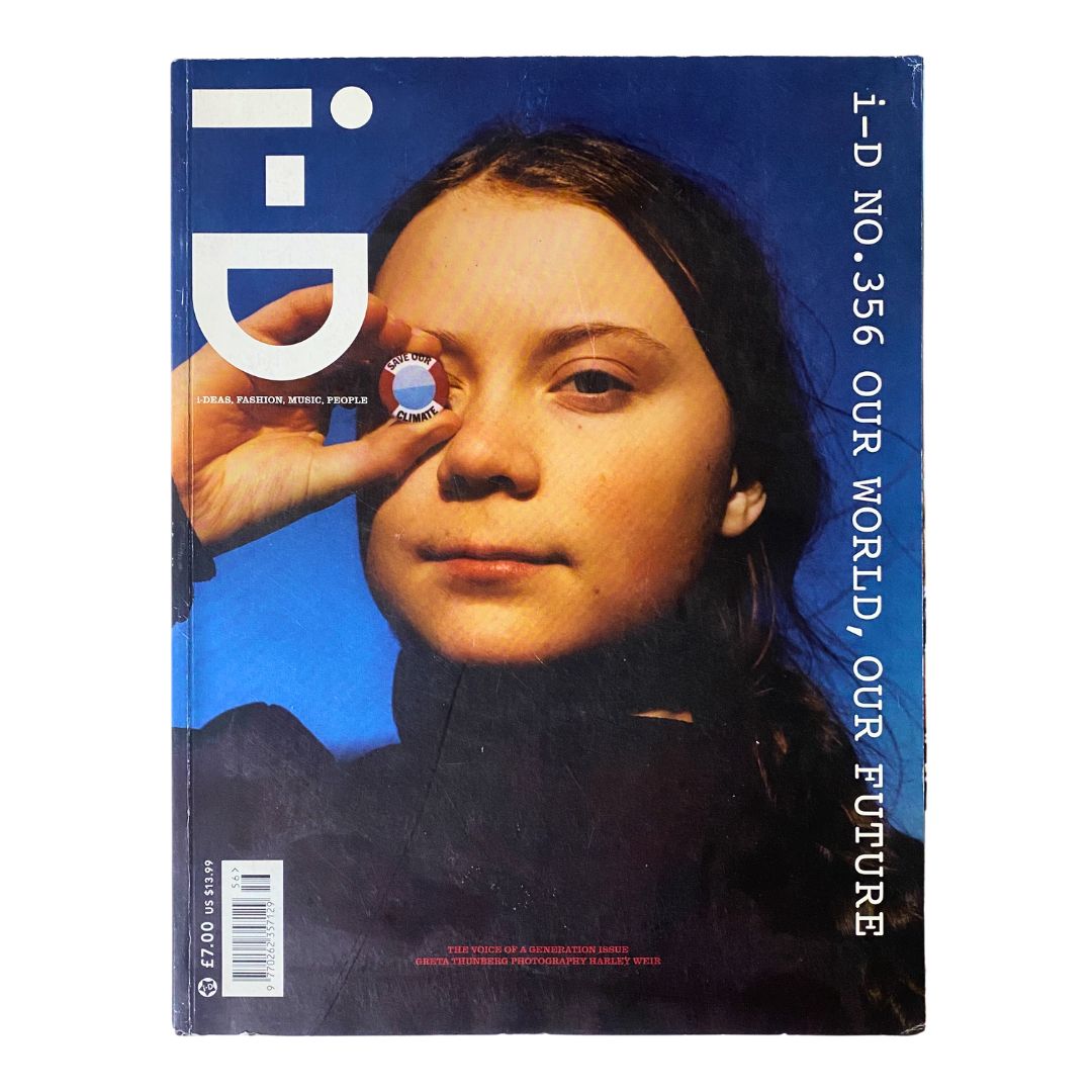 Cover of i-D Magazine May 2019 No. 356 featuring the theme Our World, Our Future, showcasing a portrait of a young woman with a unique perspective through her fingers against a vibrant blue background.
