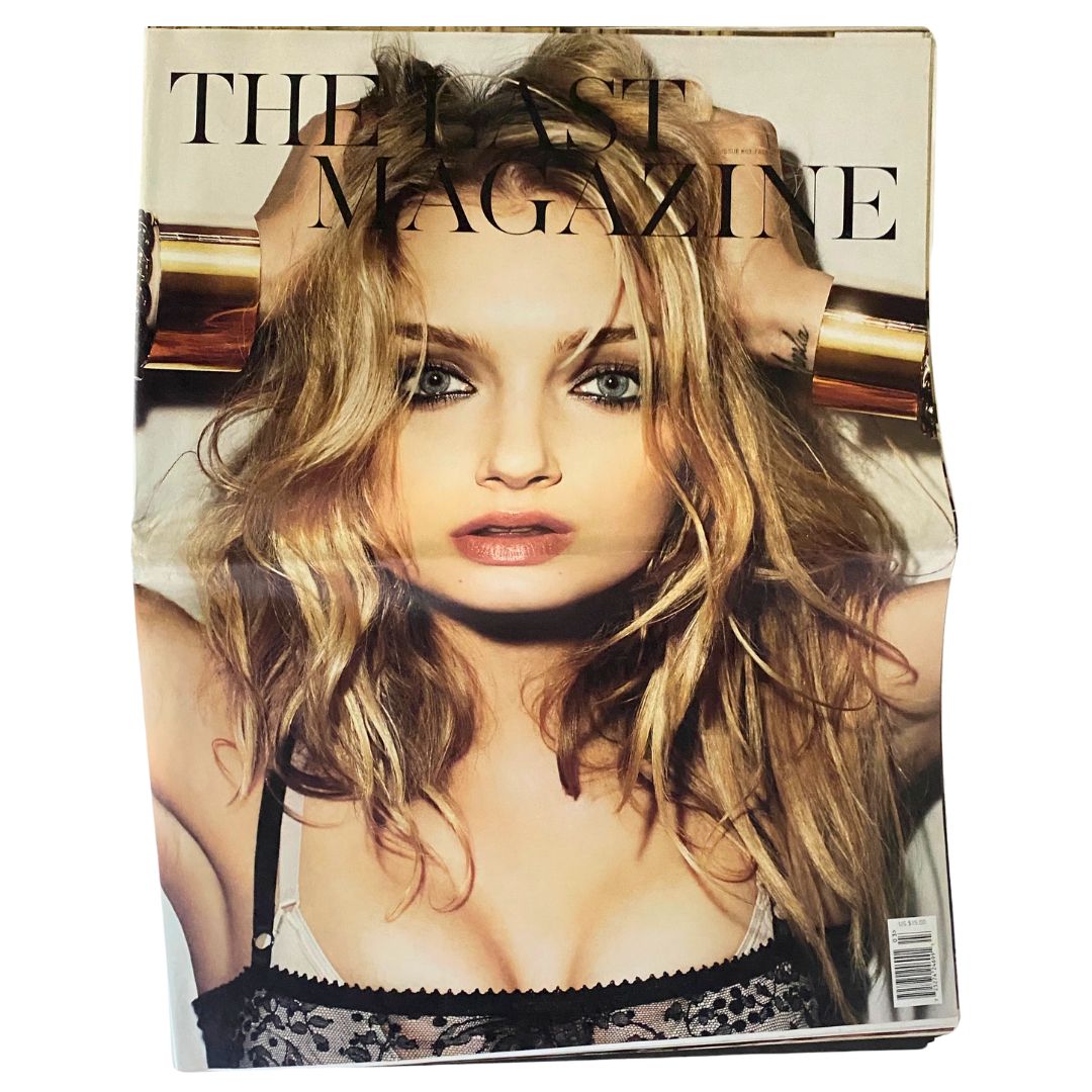 Cover of The Last Magazine Fall 2009 No. 03 featuring a portrait of a model with long, wavy hair, wearing a stylish outfit, and posing against a soft background. The magazine title is prominently displayed.