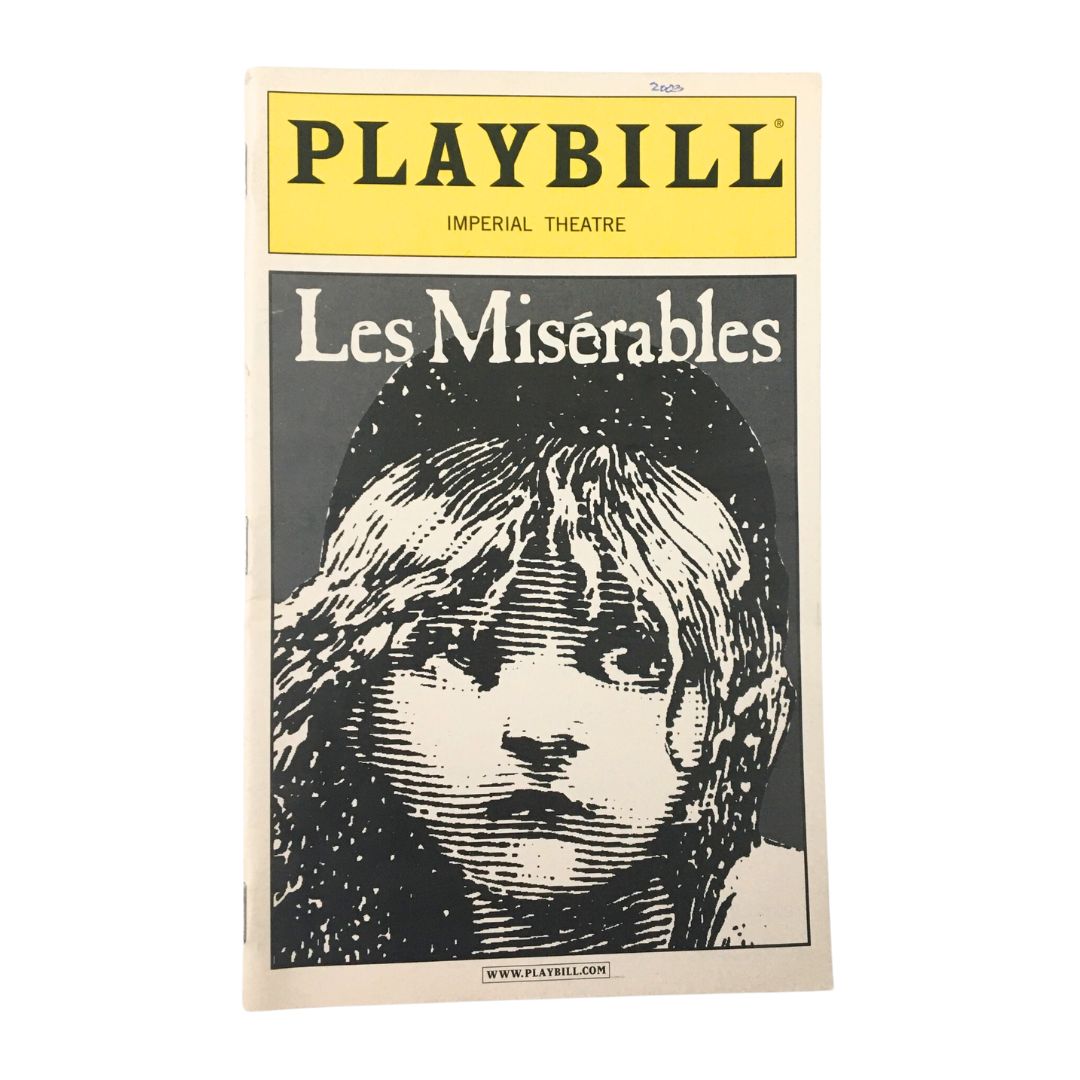 2003 Playbill for Les Miserables at the Imperial Theatre, featuring iconic artwork of a young girl with a somber expression.