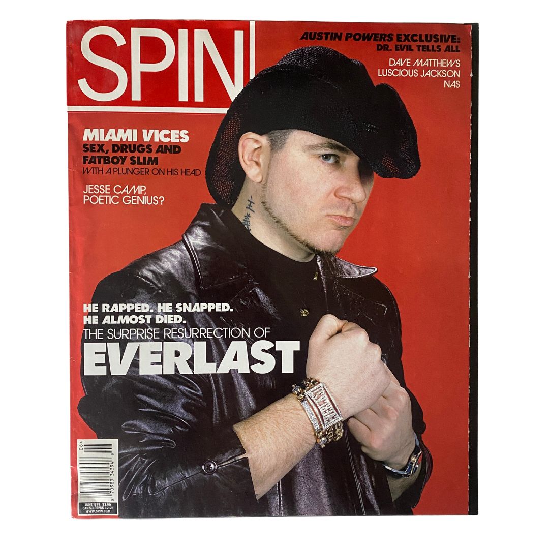Cover of Spin Magazine June 1999 Vol 15 No. 6 featuring Everlast. The magazine highlights the surprise resurrection of the artist, with bold text and an image showcasing a male figure in edgy attire, complemented by a striking red background.