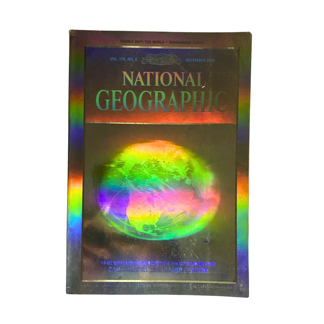 Cover of the National Geographic Magazine December 1988 featuring a colorful double map of the world, showcasing the publication's iconic design and historical significance.