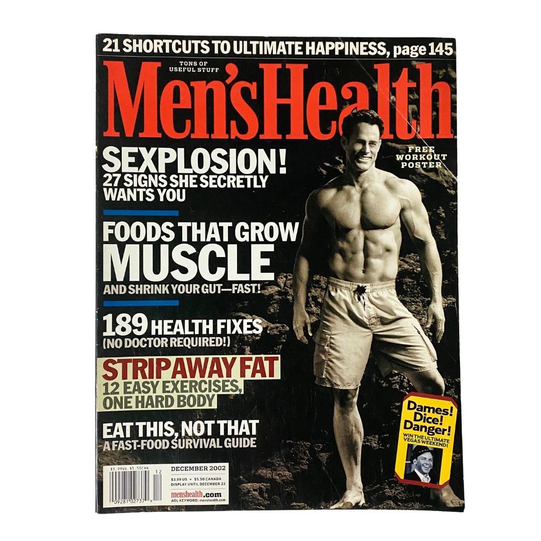 December 2002 edition of Men's Health Magazine featuring the cover story 'Foods That Grow Muscle', showcasing a muscular man on the front with headlines about fitness and health.
