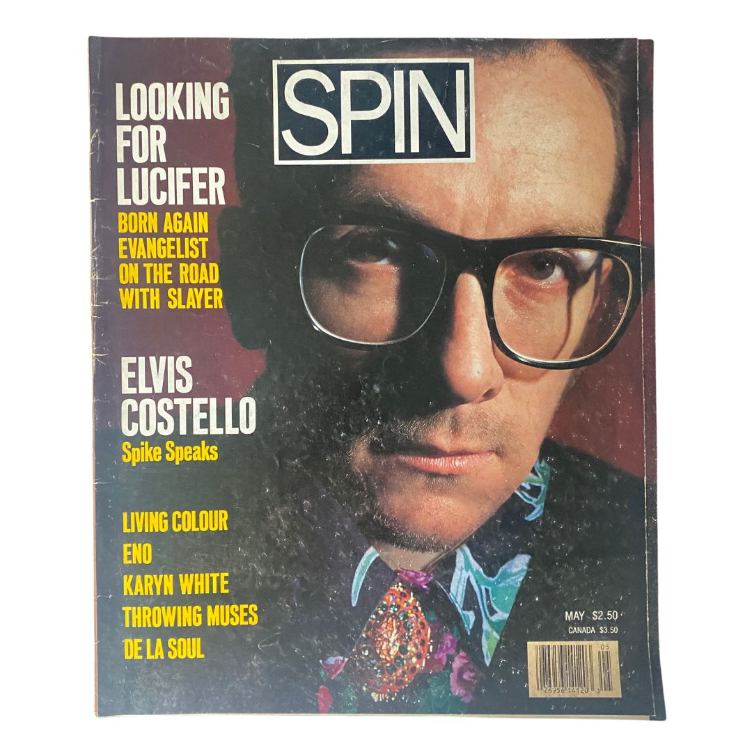 Cover of VTG Spin Magazine May 1989 Vol 5 No. 2 featuring Elvis Costello, showcasing vibrant colors and text highlights regarding music of the era.