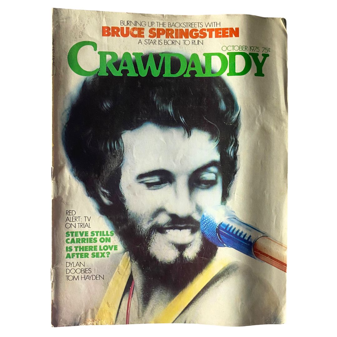 Cover of Crawdaddy Magazine from October 1975 featuring Bruce Springsteen, showcasing vibrant artwork and headlines related to music culture.