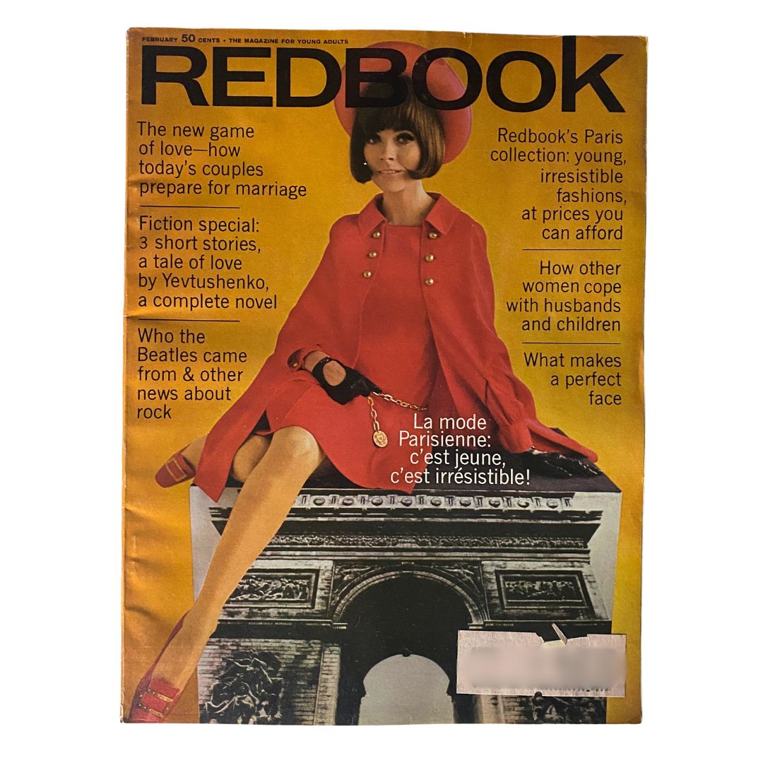 Cover of VTG Redbook Magazine February 1968 Volume 130 No. 4 La Mode Parisienne featuring a stylish model in a red outfit, set against a backdrop of the Arc de Triomphe. The cover highlights topics on Parisian fashion and lifestyle.