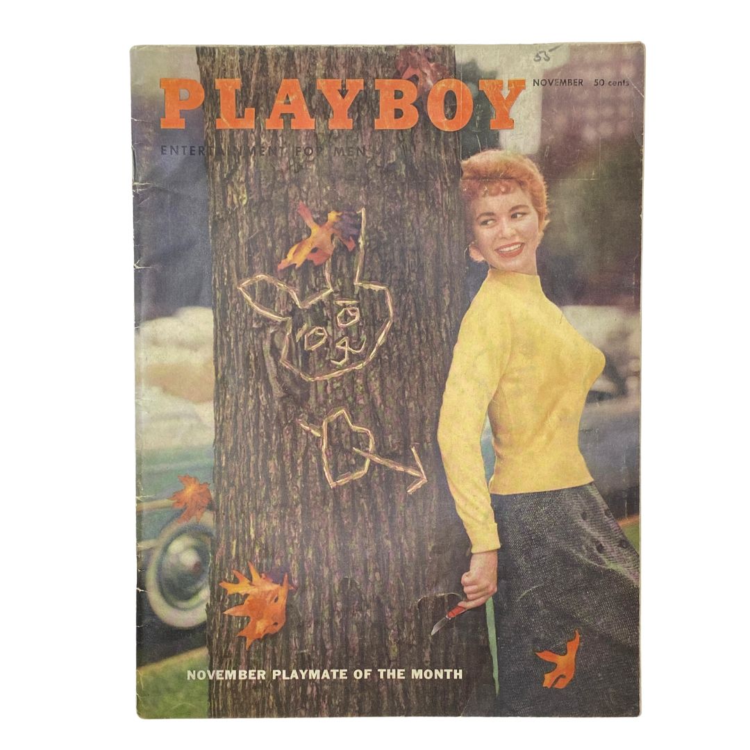 Front cover of VTG Playboy Magazine November 1955 featuring an illustration by Pat Lawler, showcasing a woman in a yellow sweater with trees and autumn leaves in the background.