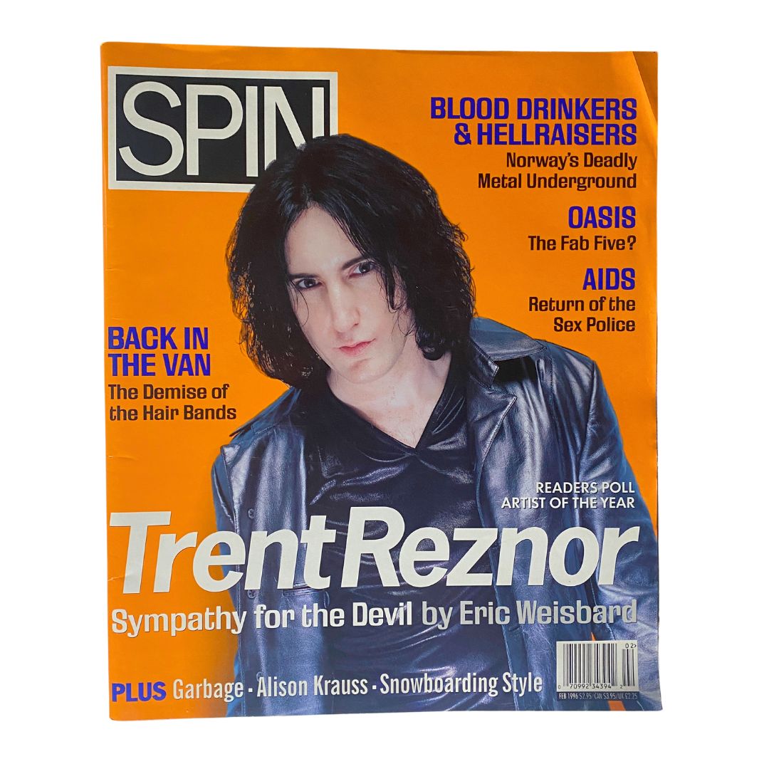 Spin Magazine February 1996 Vol 11 No. 11 featuring Trent Reznor on the cover, highlighting alternative rock culture. The cover includes bold text and the magazine's name prominently displayed.