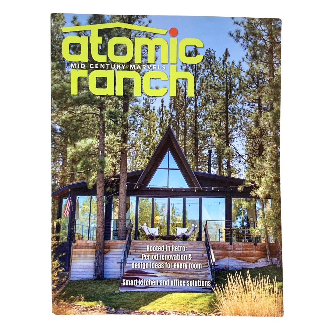 Cover of Atomic Ranch Magazine Fall 2020 showcasing a modern home design with large windows, surrounded by trees, focusing on smart kitchen and office solutions.