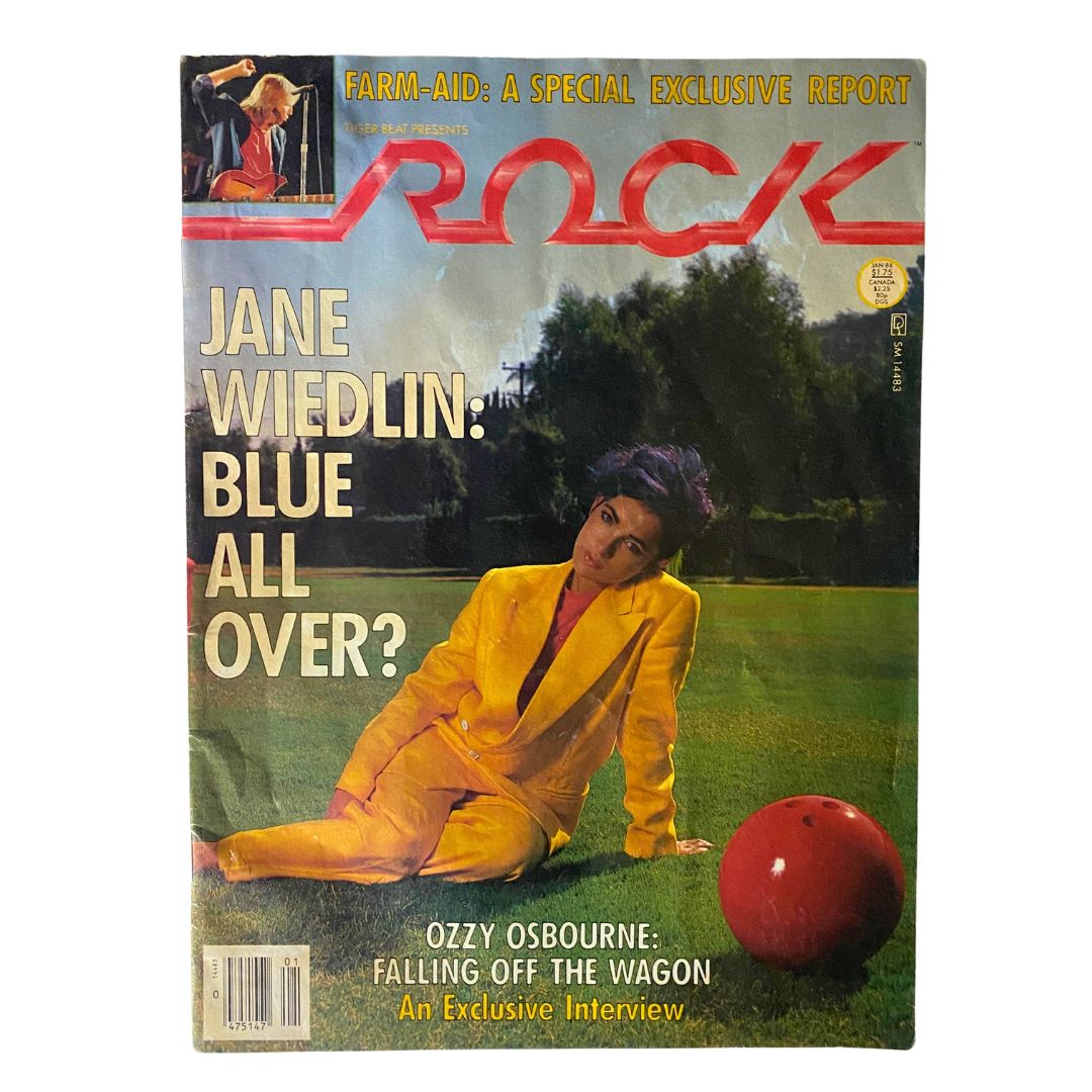 Vintage magazine cover of Tiger Beat, January 1986 edition featuring Jane Wiedlin in a yellow suit. Title reads 'Jane Wiedlin: Blue All Over?' with a red bowling ball placed next to her.
