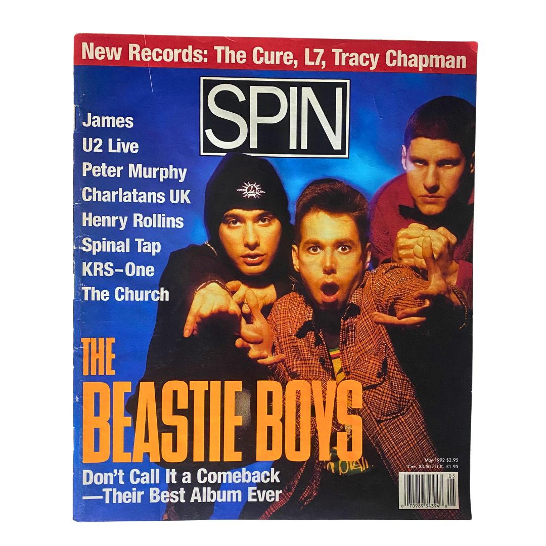 Cover of Spin Magazine May 1992, Vol 8 No. 2 featuring the Beastie Boys, showcasing a vibrant design with text on music releases and an iconic band image.