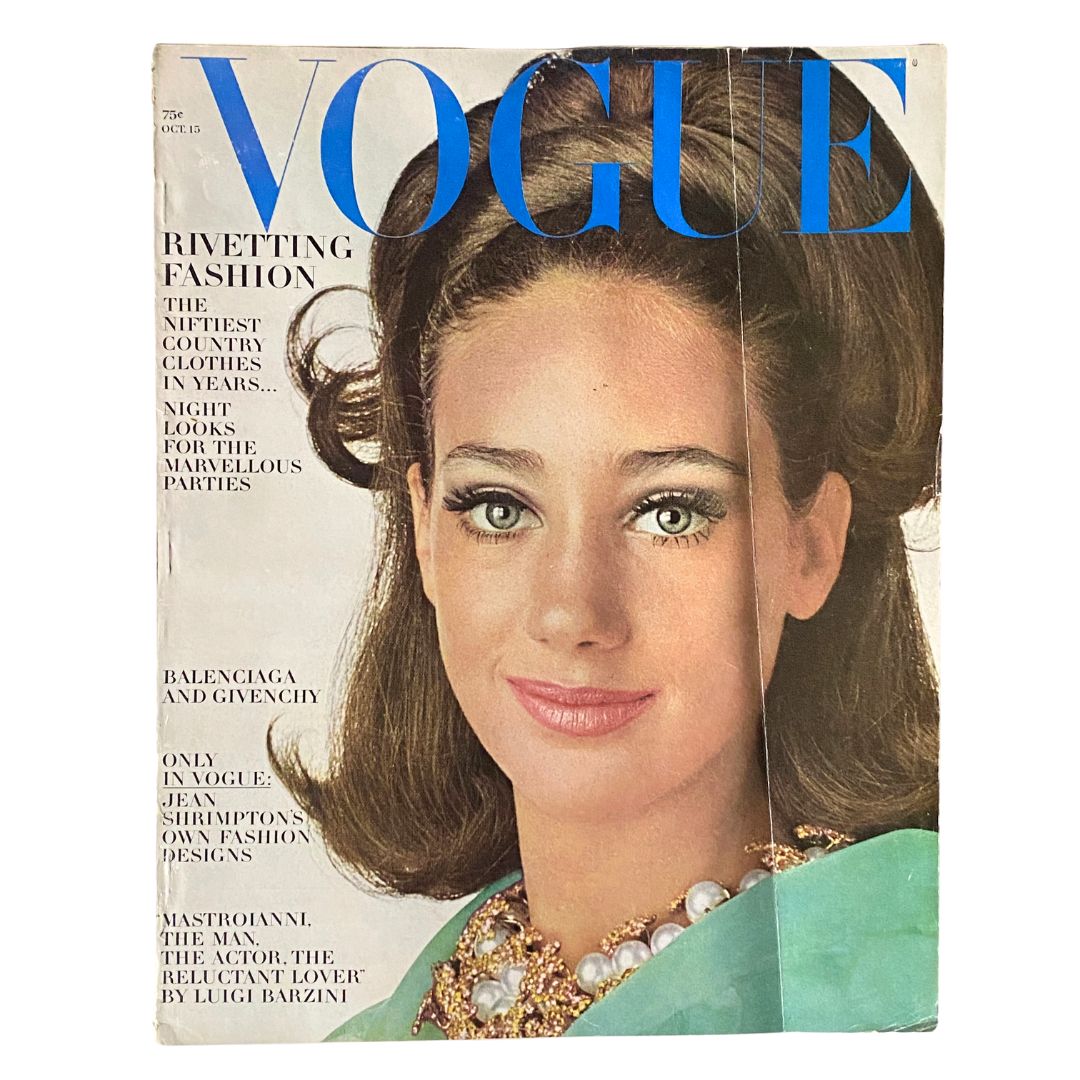 Cover of VTG Vogue Magazine October 15, 1965 featuring Marisa Berenson with the title 'VOGUE' in bold blue letters, showcasing vintage fashion of the 60s.