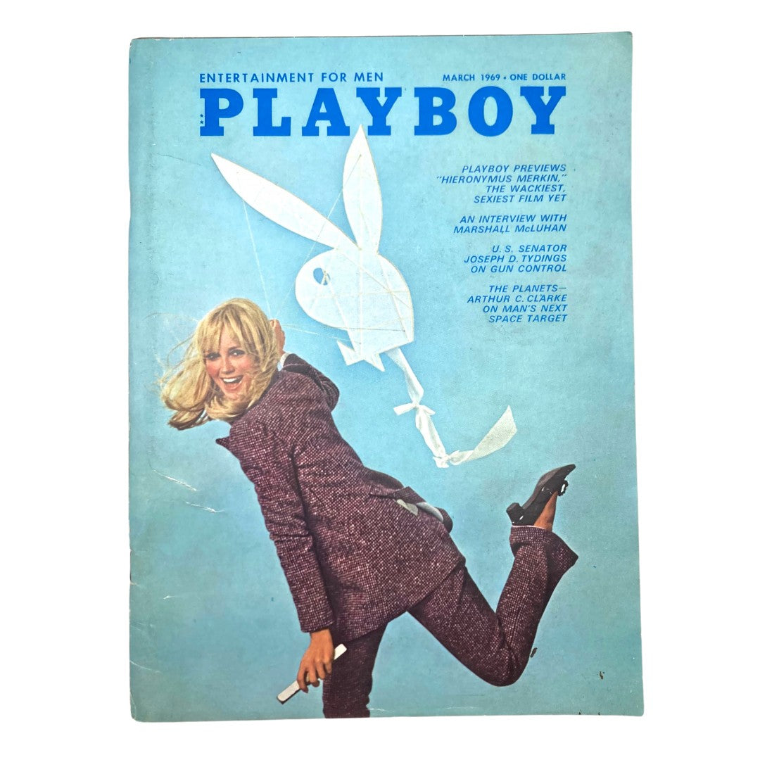 Playboy Magazine March 1969 featuring Penny James on the cover in a stylish outfit, showcasing the magazine's iconic branding and cultural significance.