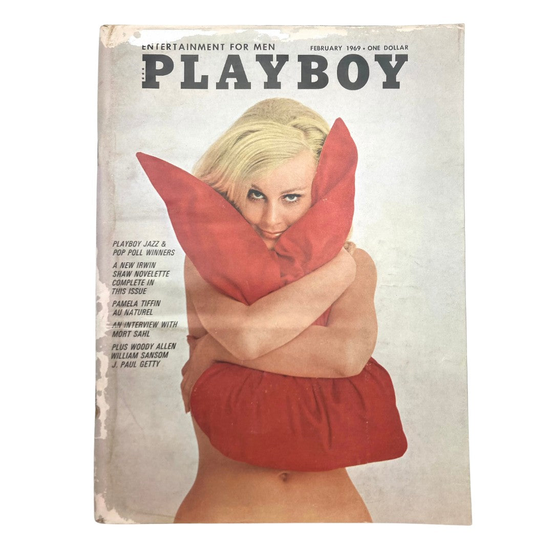 Cover of Playboy Magazine February 1969 featuring a model holding a red pillow, showcasing the vintage design theme and the iconic Pamela Tiffin centerfold.