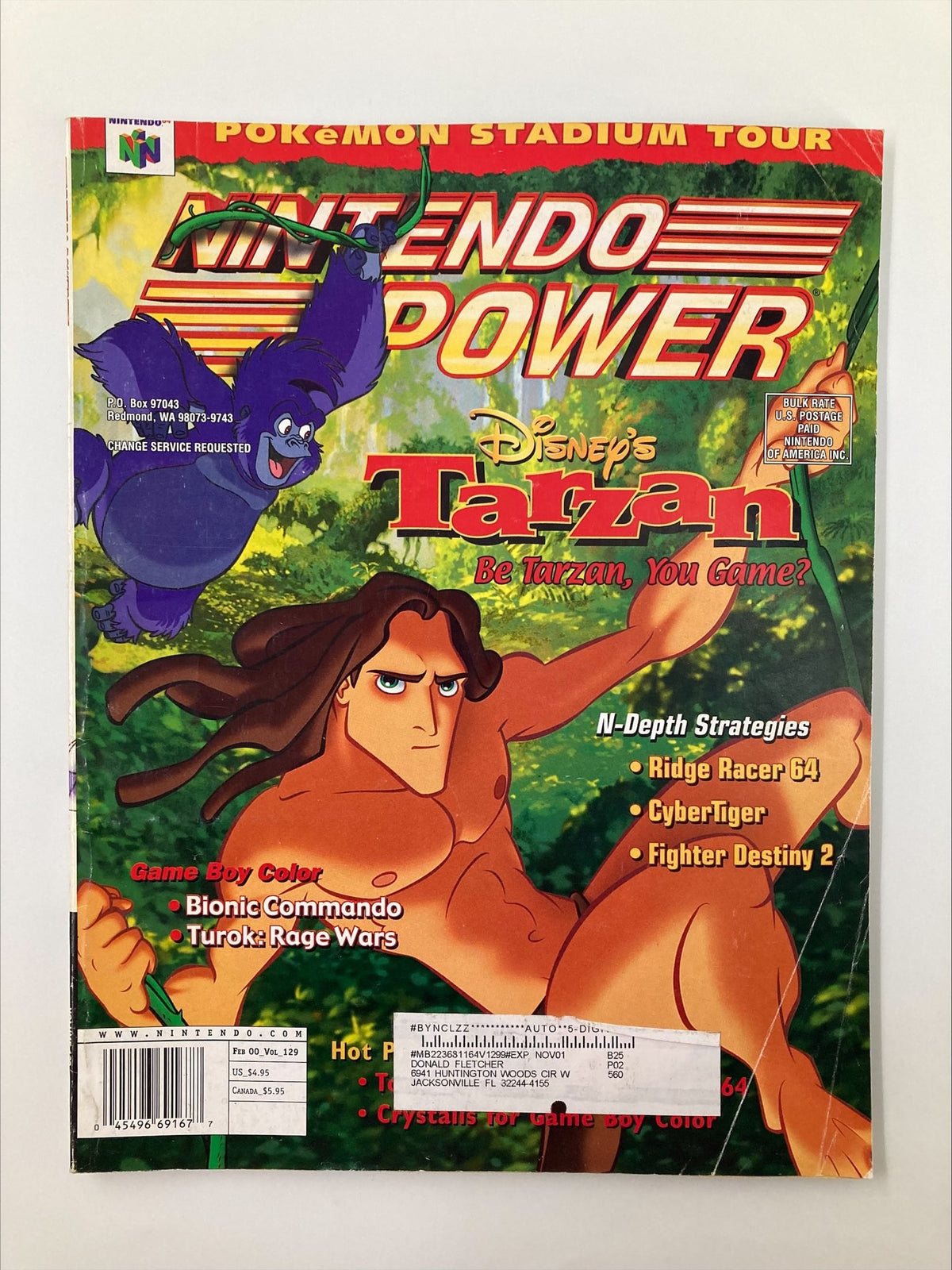 Nintendo Power Magazine Vol. 129 February 2000 featuring Disney's Tarzan on the cover with vibrant jungle background and character illustration.
