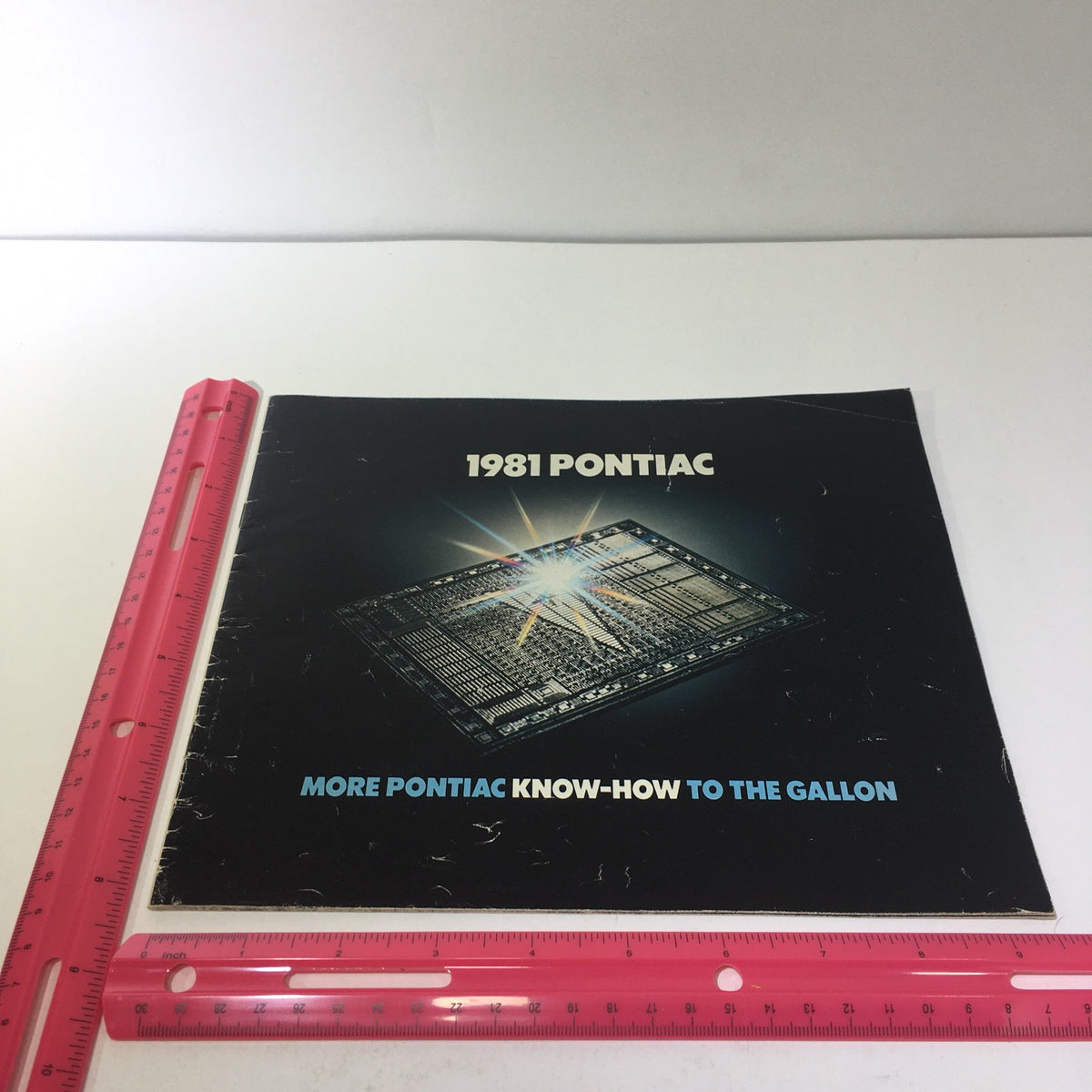 Cover of the 1981 Pontiac Firebird & Le Mans GM-Built Engines Roto in U.S.A Car Sale Brochure featuring striking design with text '1981 PONTIAC' and 'MORE PONTIAC KNOW-HOW TO THE GALLON', showcasing vintage automotive memorabilia.