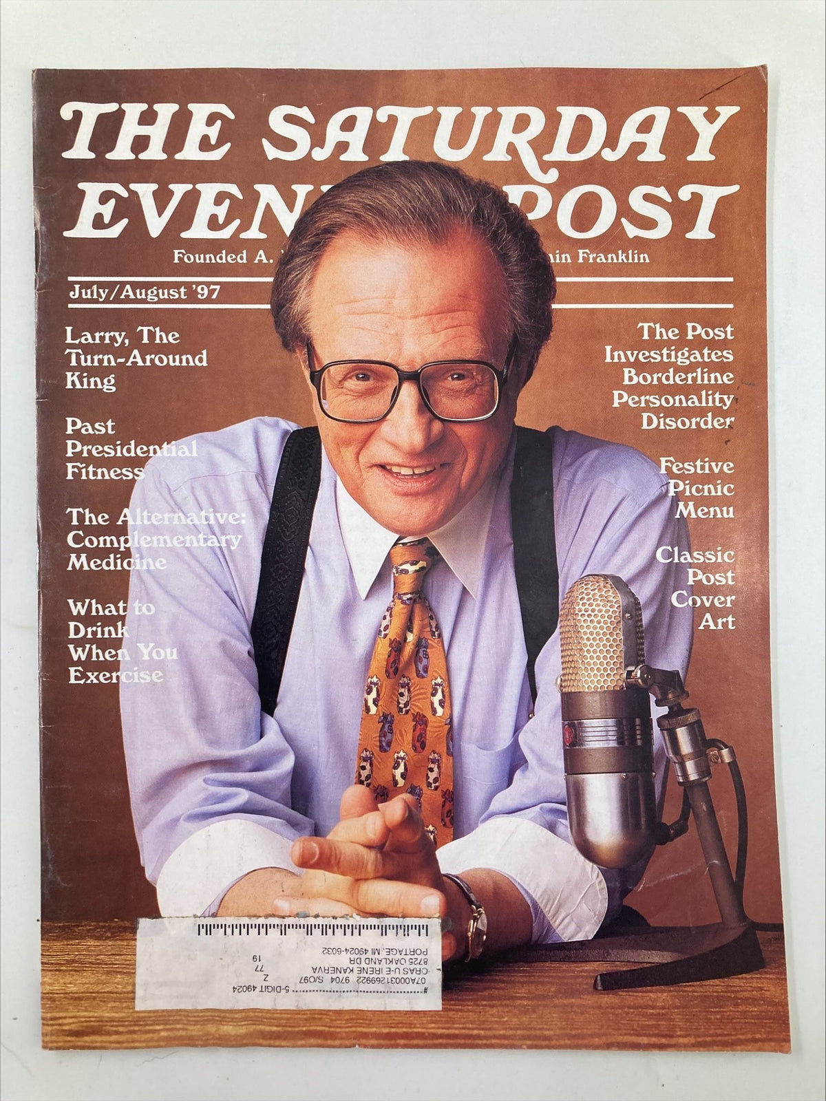 The Saturday Evening Post July 1997 cover featuring Larry King, known as The Turn-Around King. The cover displays King with glasses, a patterned tie, and a microphone, showcasing his iconic presence in broadcasting alongside various featured articles.
