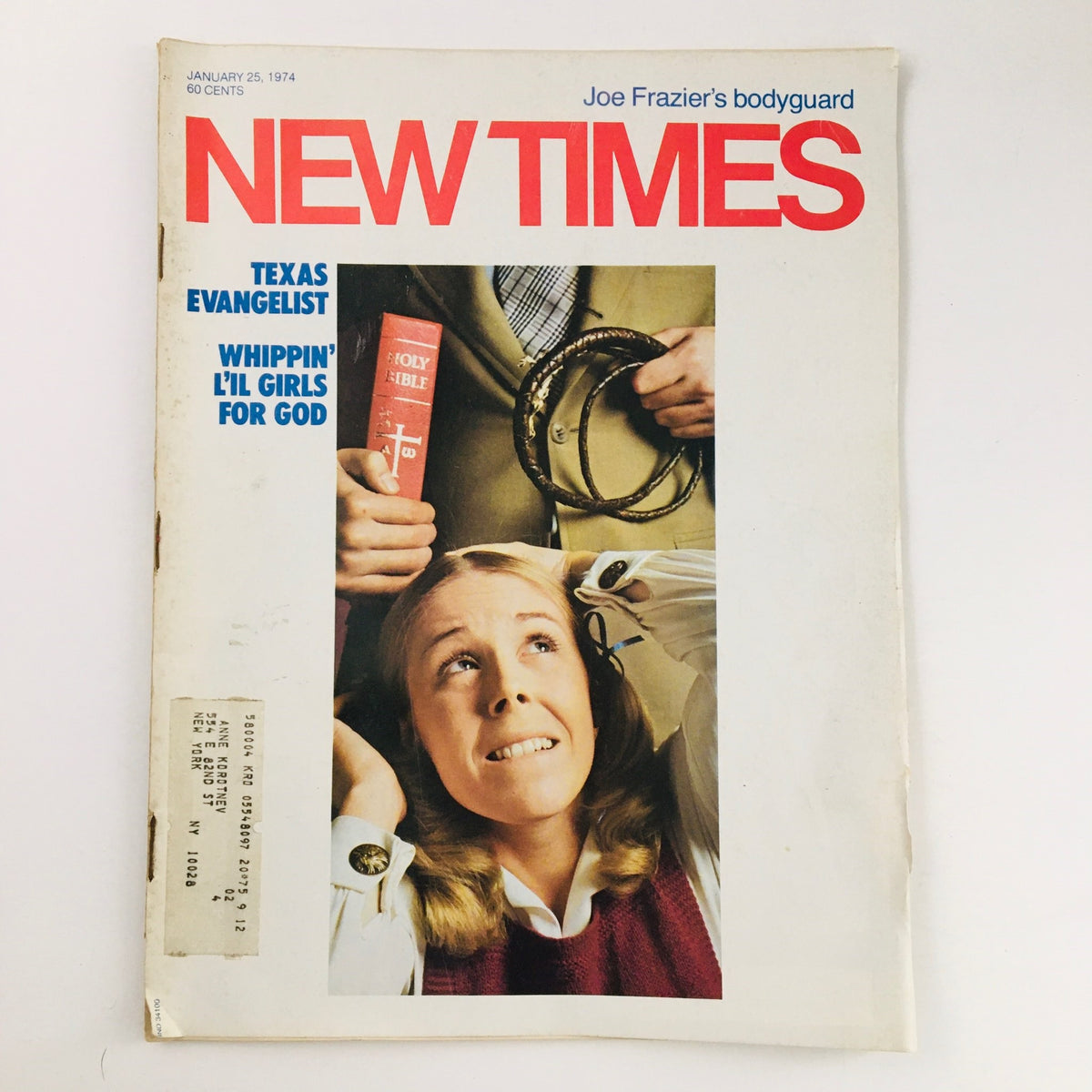 Cover of New Times Magazine from January 25, 1974, featuring an article about a Texas evangelist and a profile on Joe Frazier's bodyguard. The image shows a woman with blonde hair looking apprehensive, holding her head while a man in a suit holds a Bible and a lasso.