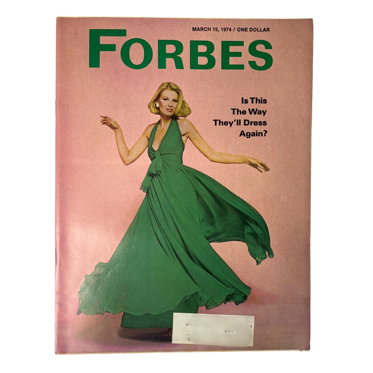 Cover of Forbes Magazine March 15, 1974, featuring the headline 'Is This The Way They'll Dress Again?' with an image of a woman in a green dress, showcasing vintage fashion trends.