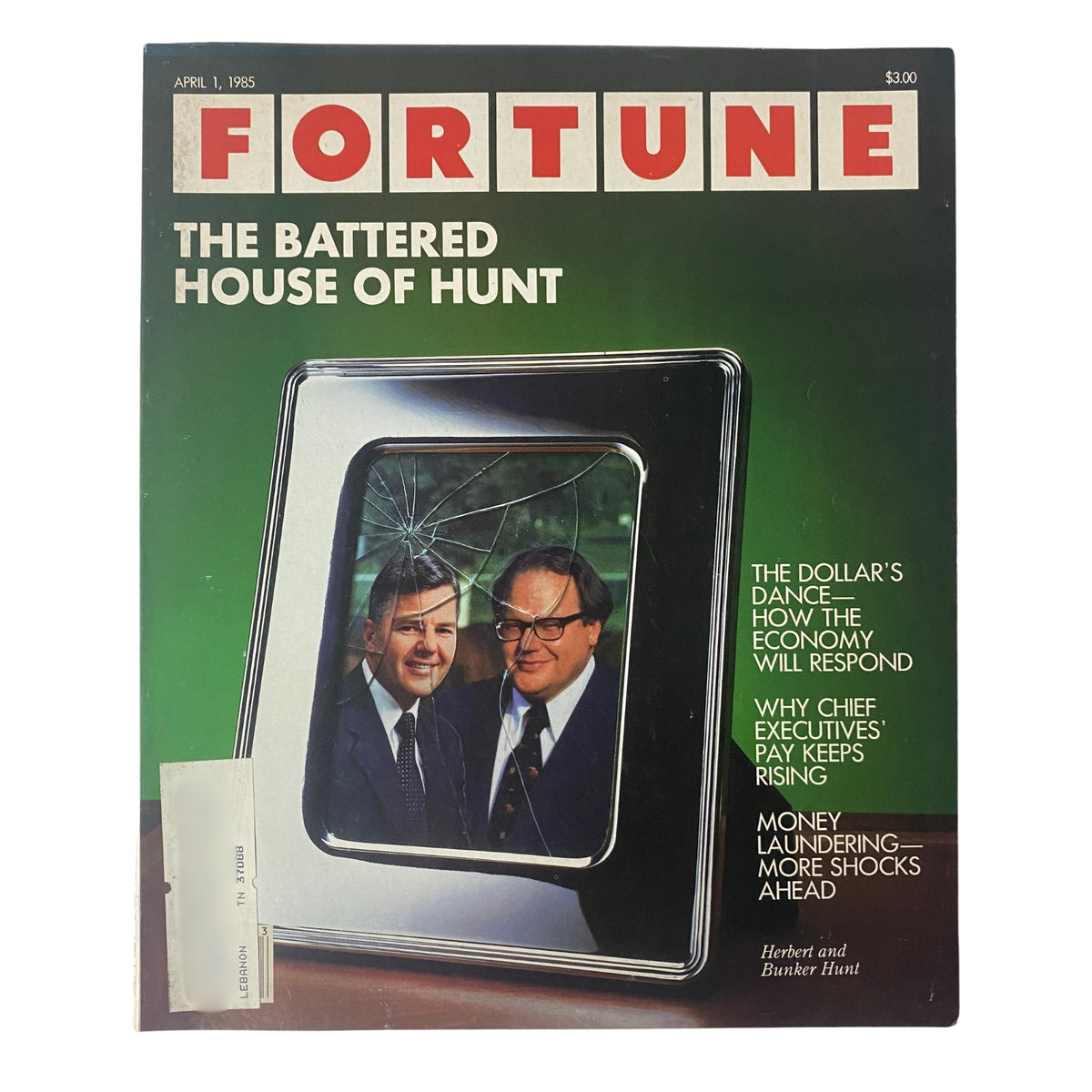 Fortune Magazine cover from April 1, 1985 featuring the title 'The Battered House of Hunt' with a striking image of Herbert and Bunker Hunt alongside a broken picture frame, highlighting economic issues.