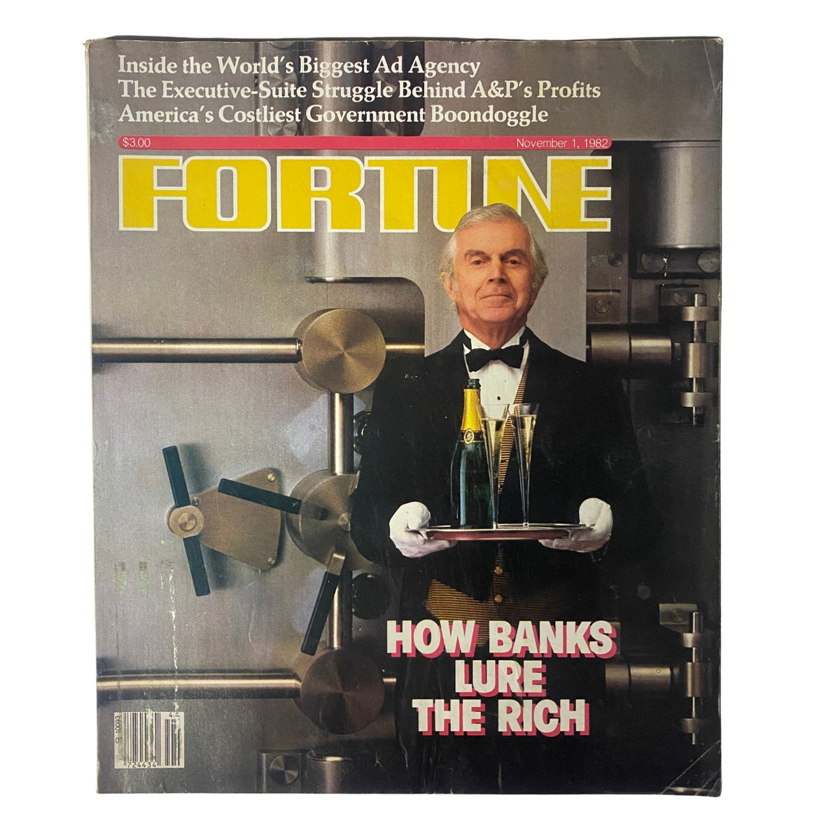 Cover of Fortune Magazine, November 1, 1982, titled 'How Banks Lure The Rich', featuring a man in a tuxedo holding champagne bottles in front of a vault.