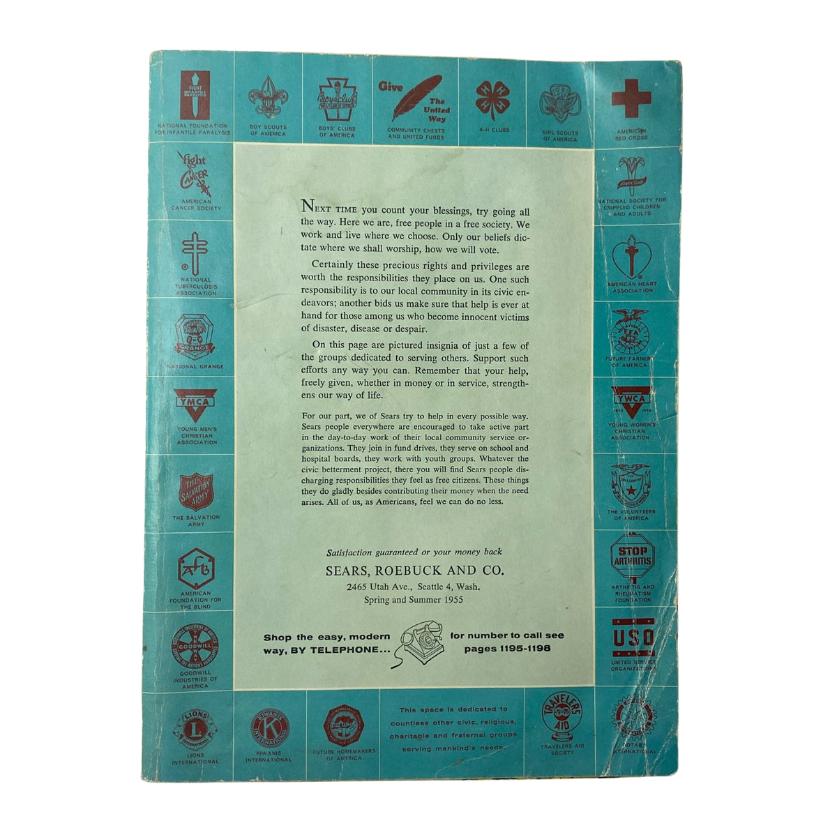 Back cover of the 1955 Sears Roebuck and Co. Spring and Summer Catalog, featuring community service messages and illustrated logos of various organizations.