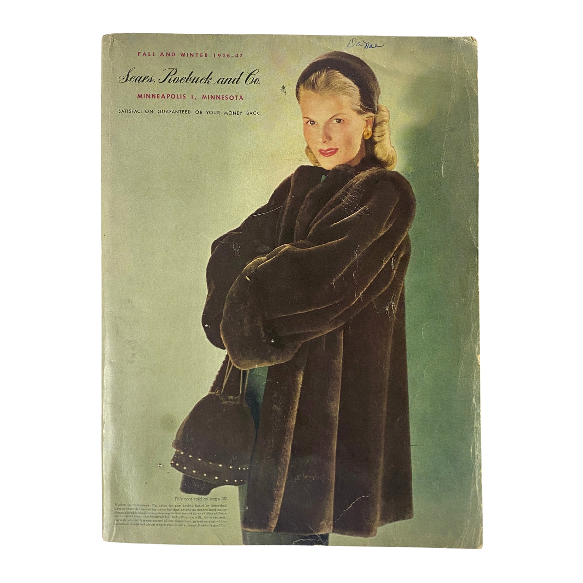 Cover of the 1946 - 1947 Sears, Roebuck and Co. Fall and Winter Catalog featuring a model in a stylish coat and carrying a handbag, showcasing post-WWII fashion trends.