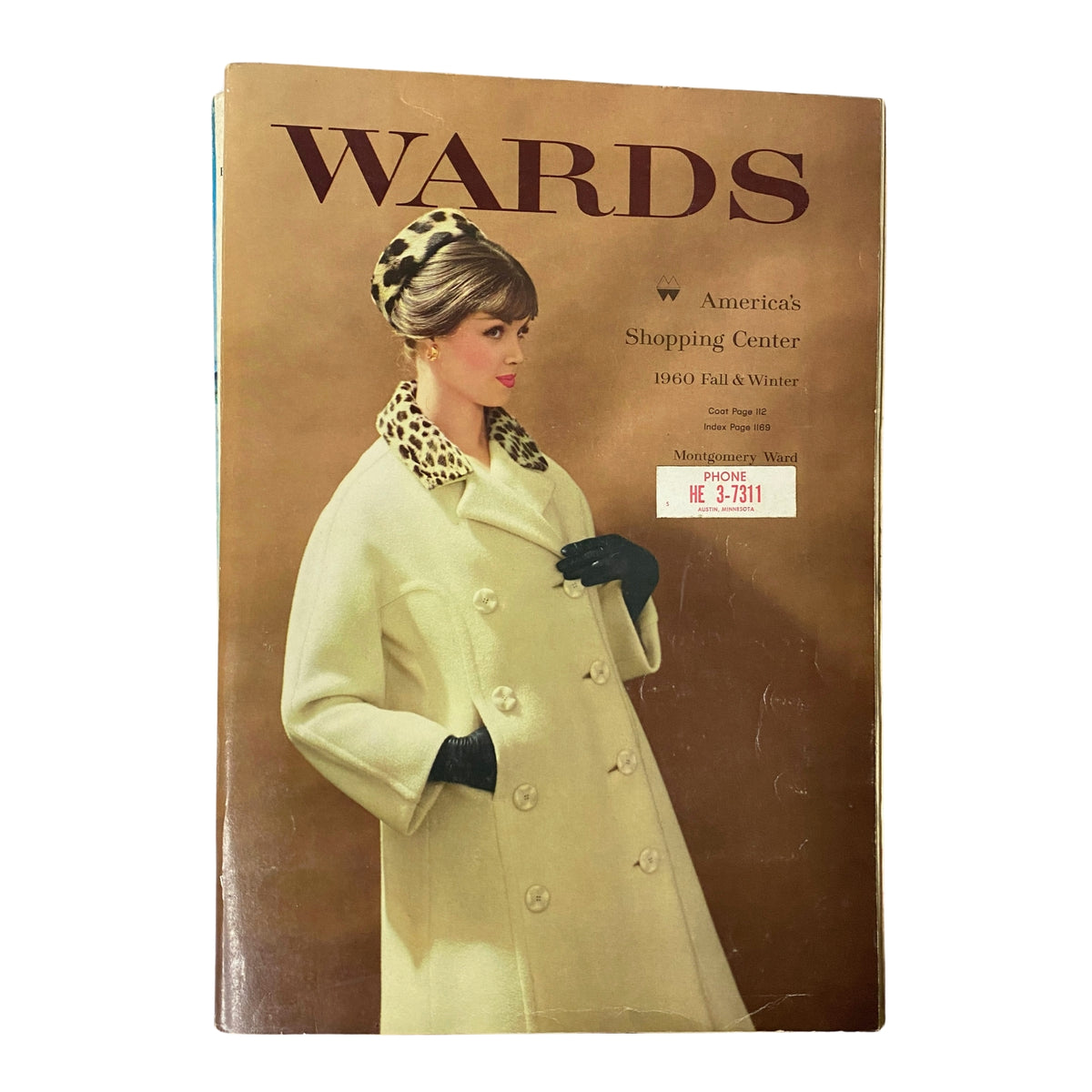 Cover of the 1960 Montgomery Ward Fall and Winter Catalog featuring a model in a stylish coat with a leopard print collar.