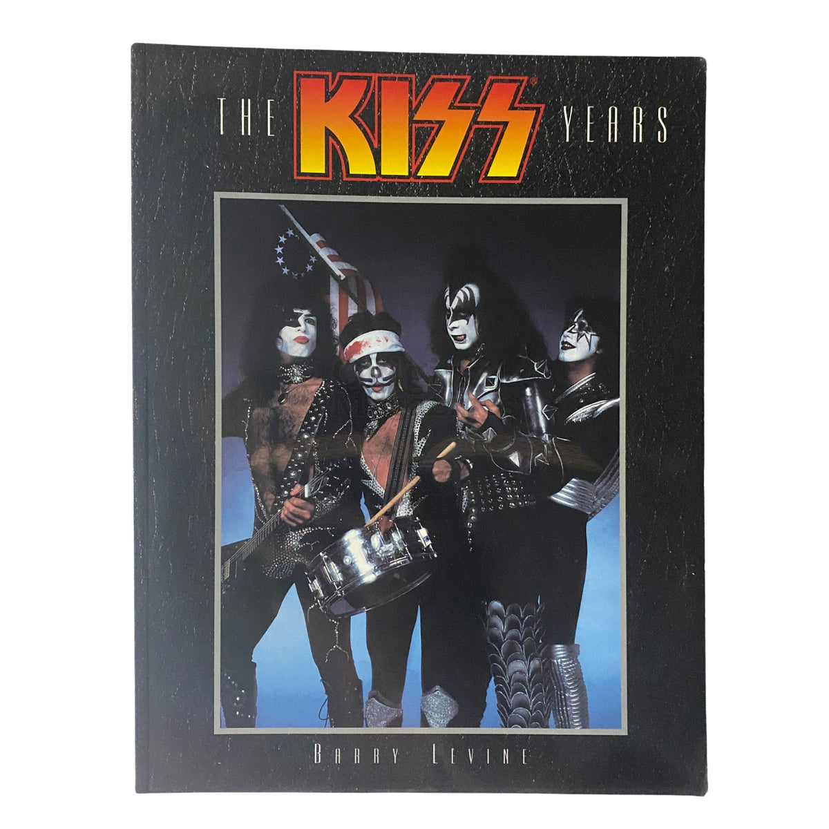 Cover of 'The KISS Years' by Barry Levine featuring a colorful depiction of the band KISS in iconic makeup and outfits, with a Santa hat on a drummer, showcasing their rock legacy.
