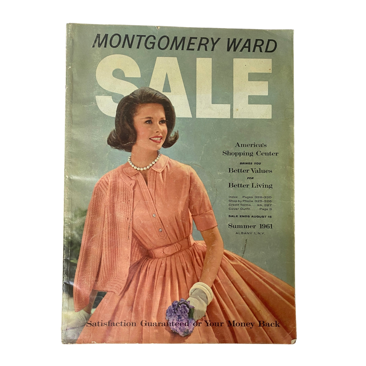 Cover of the 1961 Montgomery Ward Summer Catalog featuring a woman in a pink dress, showcasing vintage fashion and summer styles.