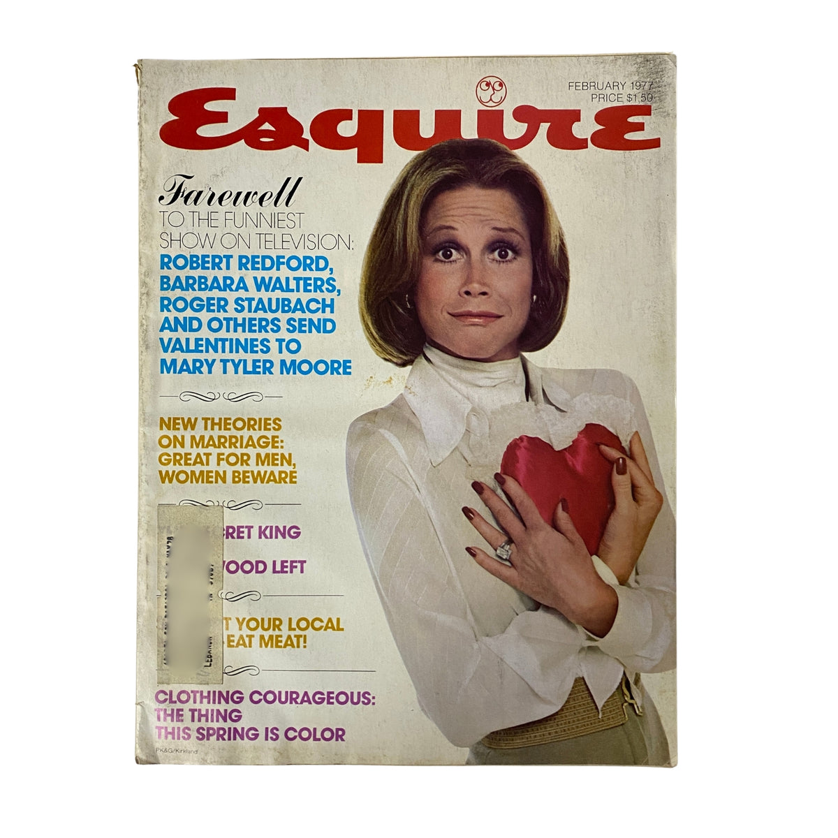 Cover of Esquire Magazine February 1977 featuring a portrait of a woman holding a heart, with headlines mentioning Robert Redford, Barbara Walters, and Roger Staubach.