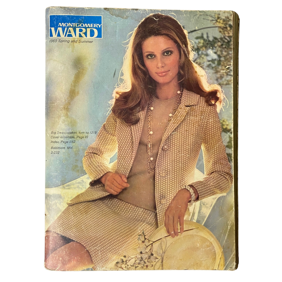 Cover of the 1969 Montgomery Ward Spring and Summer Catalog featuring a woman in a stylish outfit, representing late 1960s fashion trends.