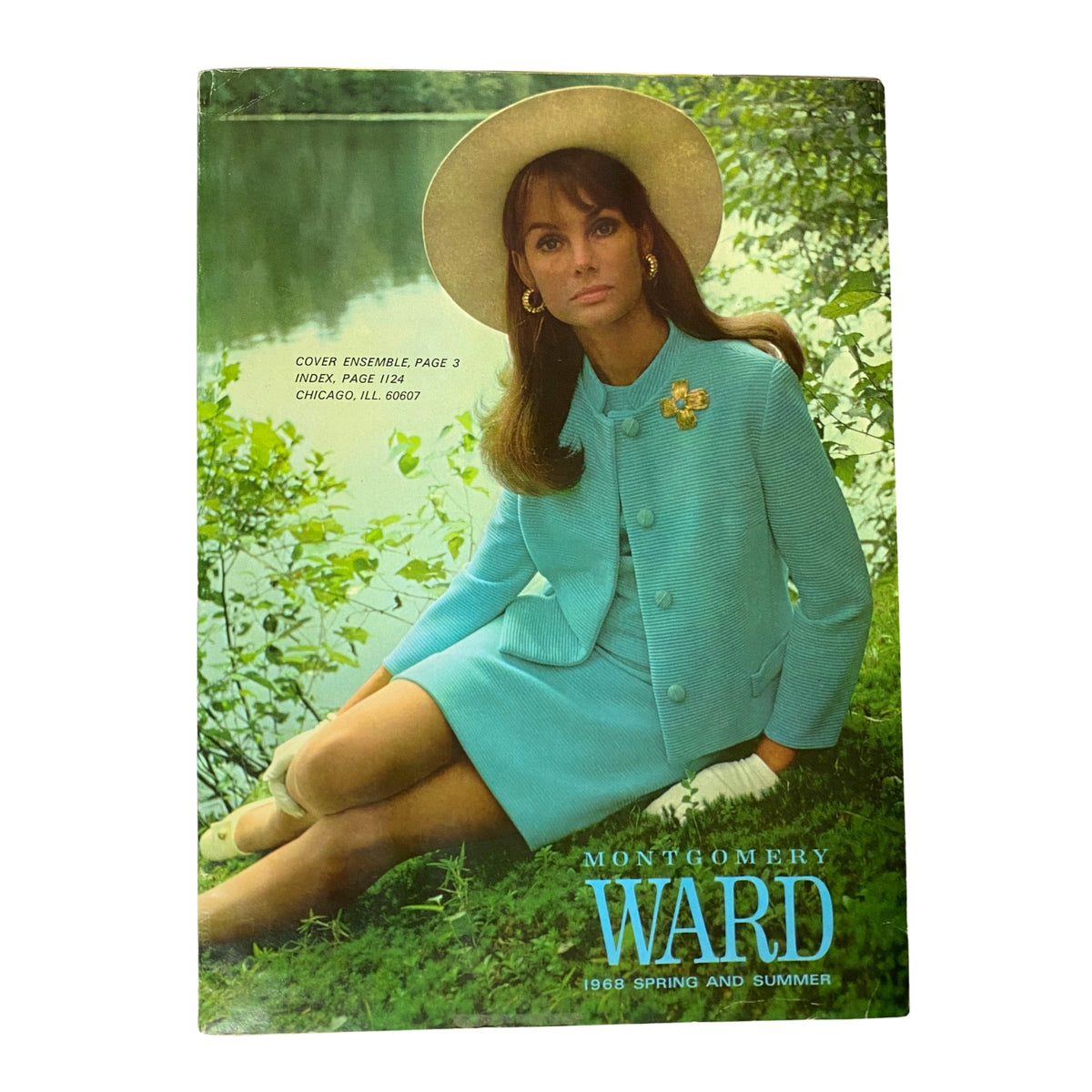 Cover of the 1968 Montgomery Ward Spring and Summer Catalog featuring a model in an elegant teal suit and wide-brimmed hat, showcasing vintage fashion aesthetics.