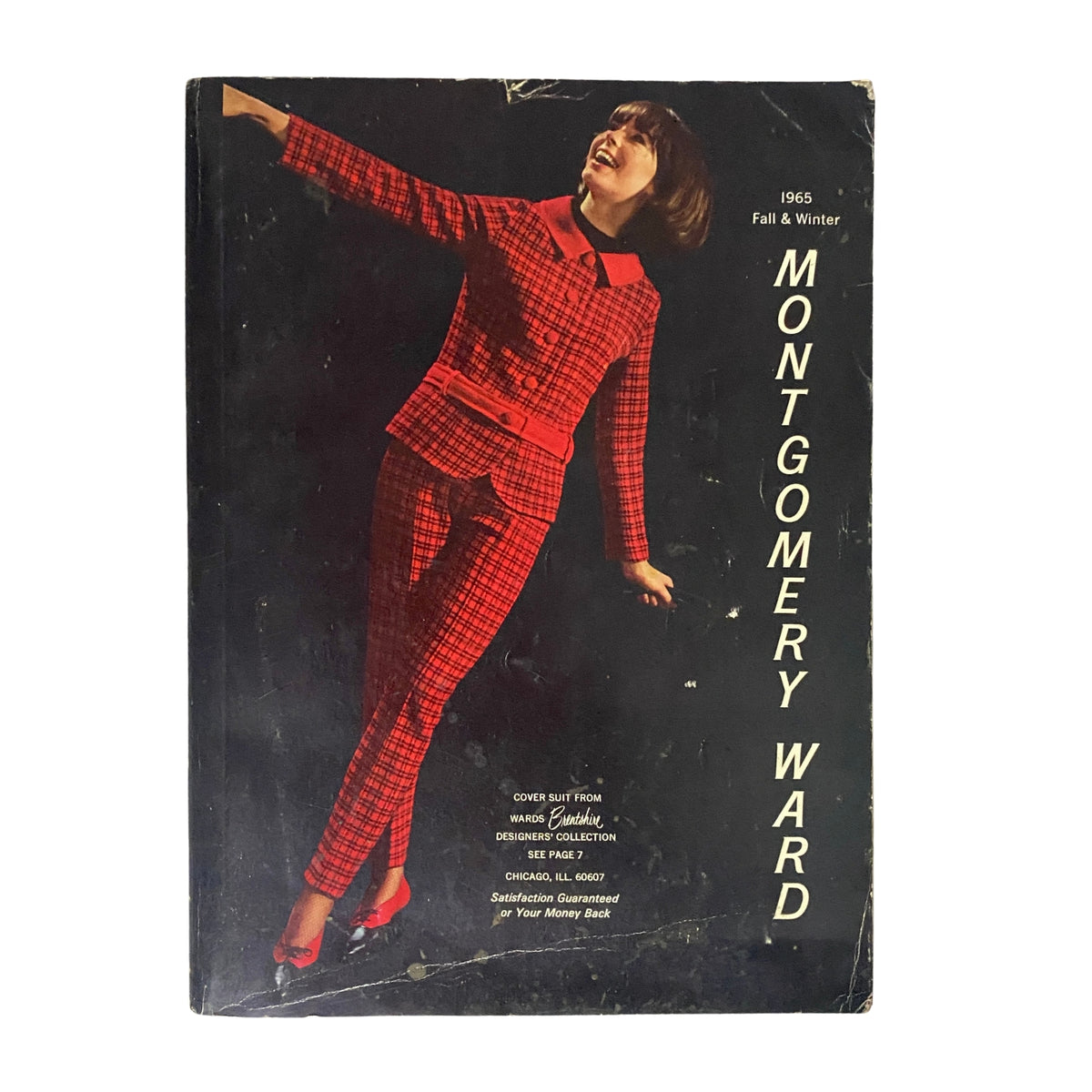 Cover of the 1965 Montgomery Ward Fall and Winter Catalog featuring a model in a stylish red plaid suit, showcasing vintage fashion trends from the mid-1960s.