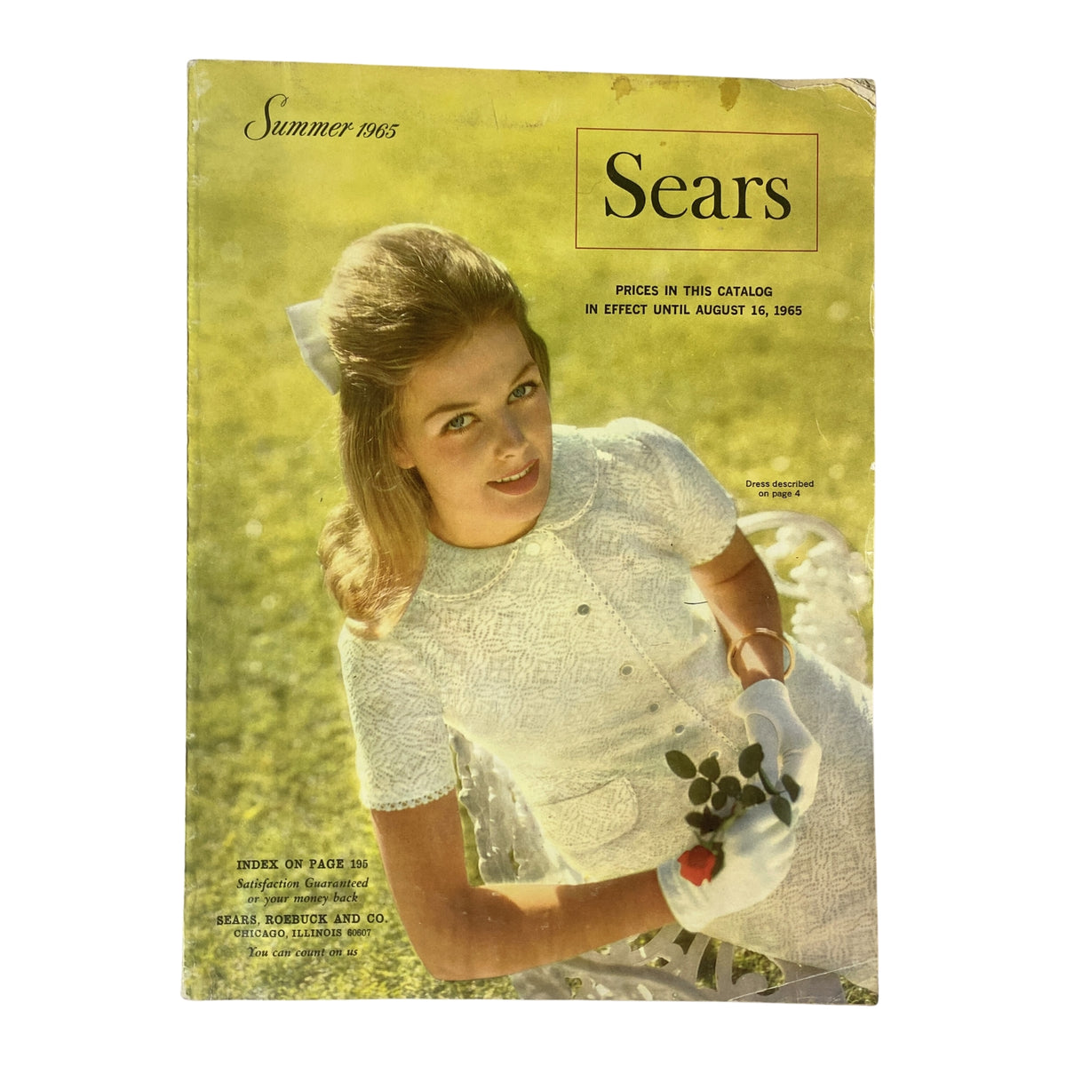 Cover of the 1965 Sears Country Style Summer Catalog featuring a young woman in a white dress with a floral bouquet, showcasing mid-century fashion.