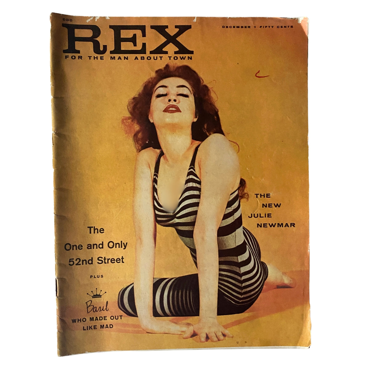 Cover of Rex Magazine December 1957 featuring actress Julie Newmar, showcasing a vintage aesthetic representative of mid-20th century culture.