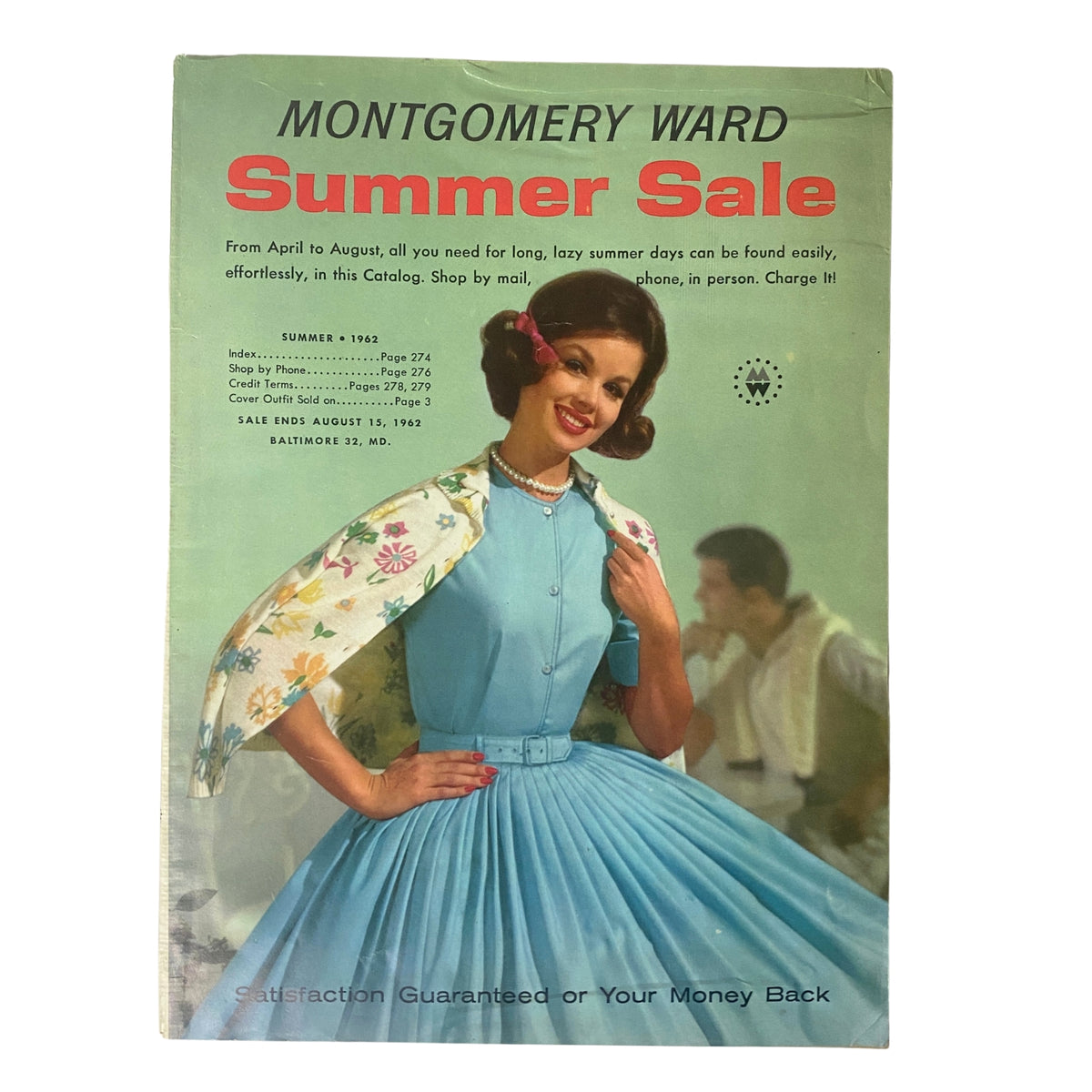 Cover of the 1962 Montgomery Ward Summer Catalog featuring a model in a stylish blue dress with a floral shawl, capturing the essence of 1960s fashion.
