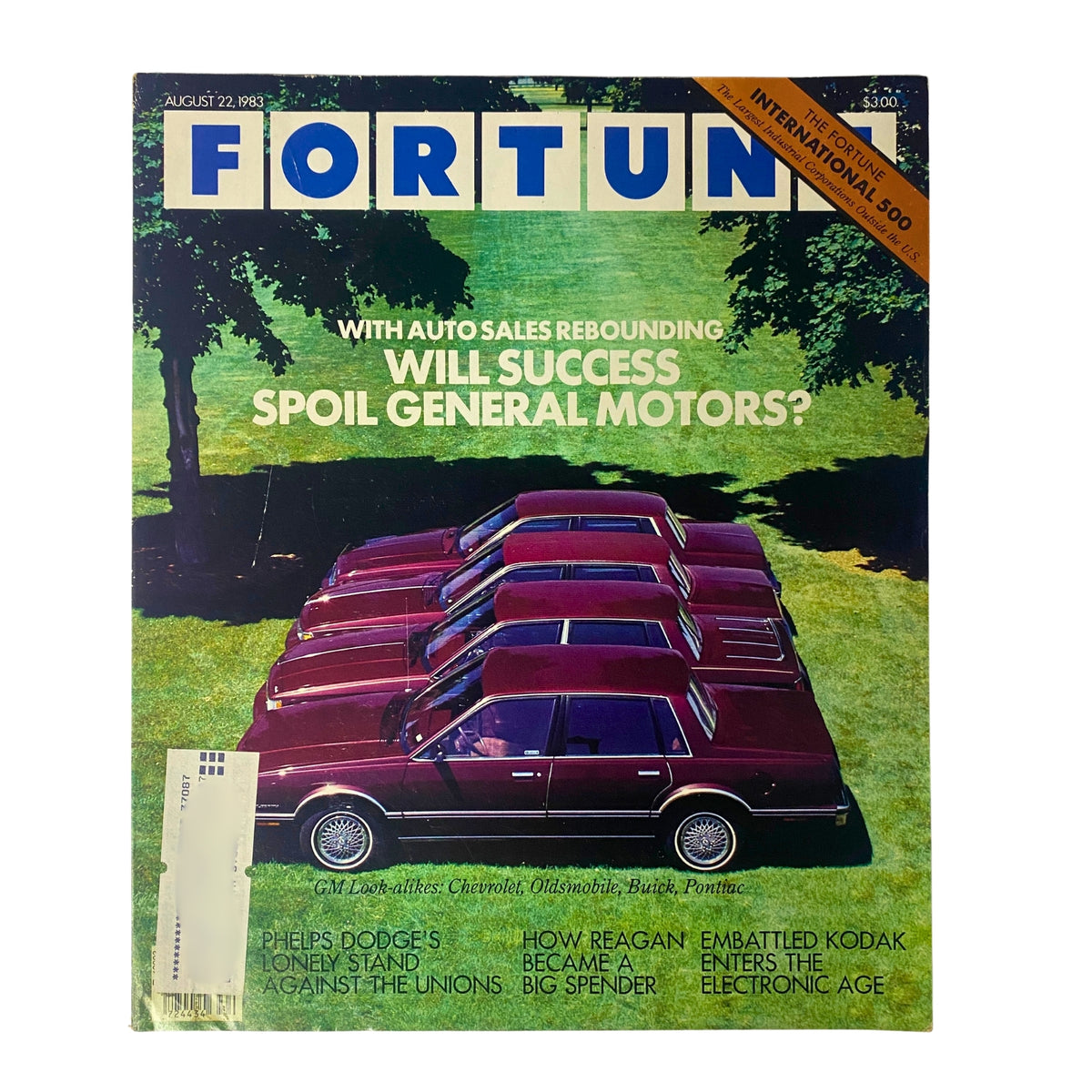 Fortune Magazine cover from August 22, 1983, showcasing the headline 'Will Success Spoil General Motors?' with a backdrop of parked cars and vibrant greenery.