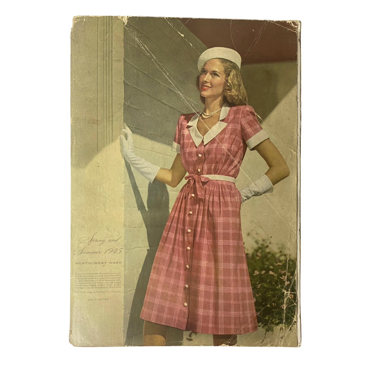 Front cover of the 1945 Montgomery Ward Spring and Summer Catalog, showcasing a woman in a pastel pink dress with white trim and gloves, embodying the fashion of the 1940s.