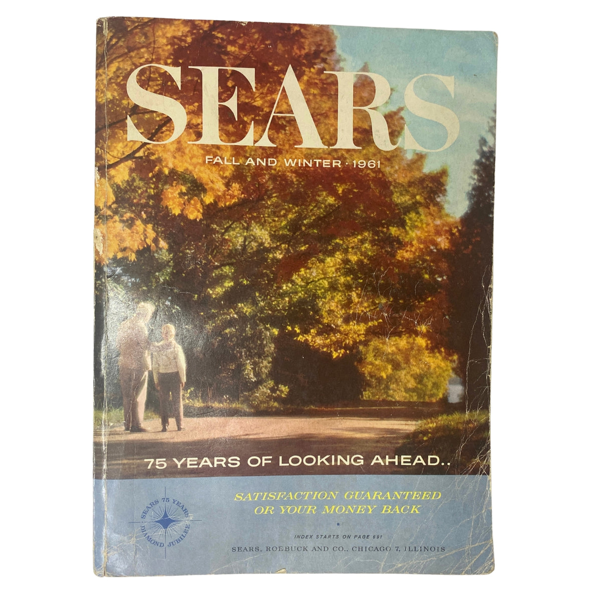 Cover of the 1961 Sears Fall and Winter Catalog featuring a scenic autumn background and the text 'Sears Fall and Winter - 1961' showcasing vintage fashion and outerwear.