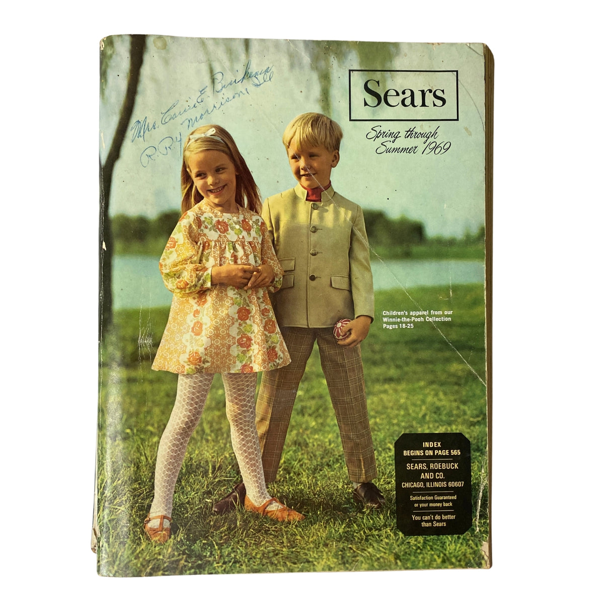 Cover of the 1969 Sears Spring Through Summer Catalog featuring two children in vintage clothing, showcasing mid-century fashion trends.