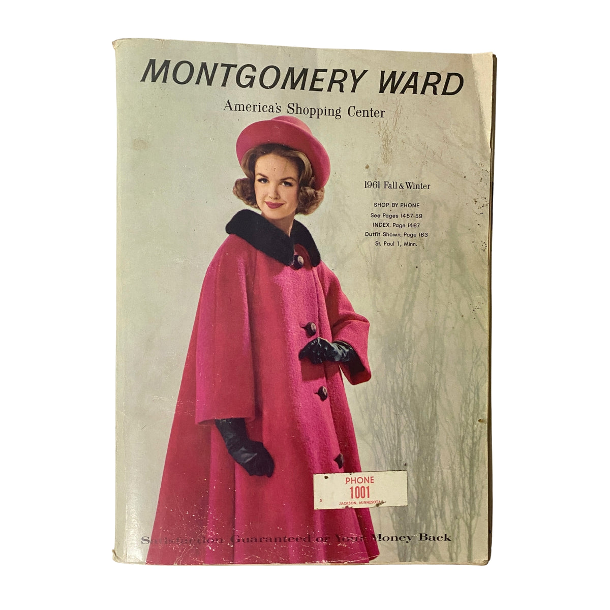 Cover of the 1961 Montgomery Ward Fall and Winter Catalog featuring a model in a pink coat and hat, representative of vintage fashion from the early 1960s.
