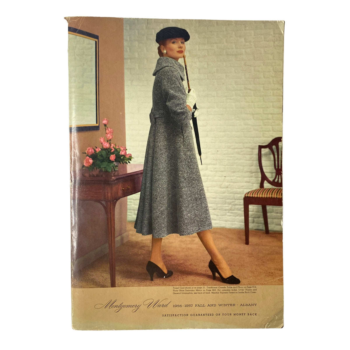 Cover image of the 1956 - 1957 Montgomery Ward Fall and Winter Catalog featuring a model in a stylish vintage wool coat and hat, captured in an elegantly designed interior.