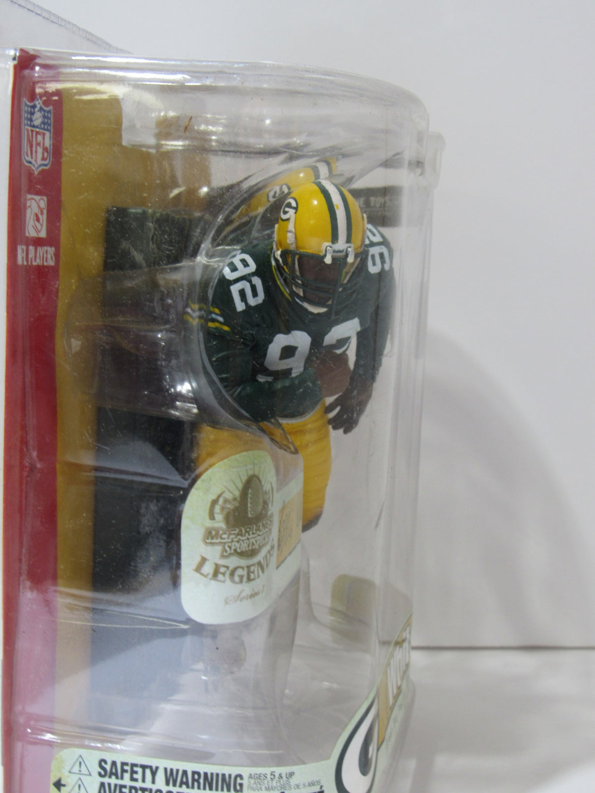 McFarlane NFL Reggie White Green Bay Packers Action Figure displayed in original packaging, highlighting the collectible design and vibrant Packers colors.