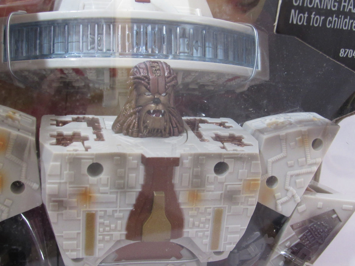 Detailed view of Chewbacca in the Star Wars Deluxe Transformer Han Solo and Chewbacca - Millennium Falcon, highlighting the intricate design and character features.