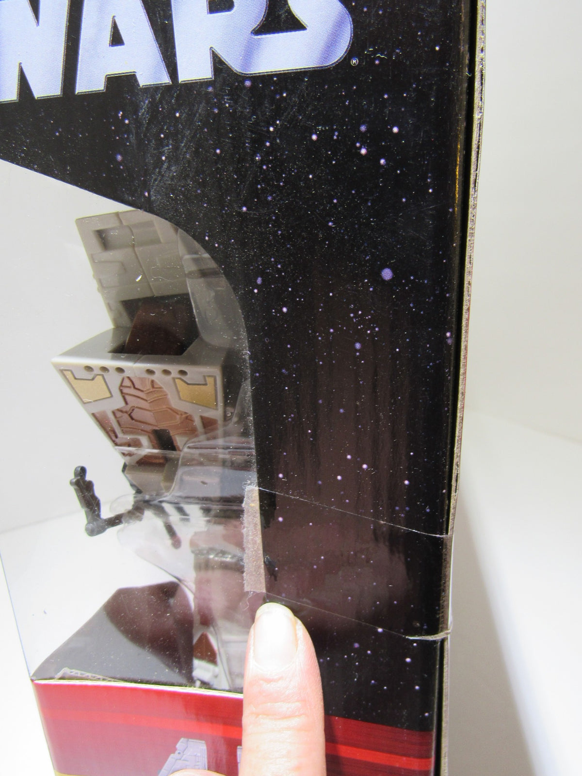 Side view of the box for Star Wars Deluxe Transformer Han Solo and Chewbacca - Millennium Falcon highlighting minor shelf wear.
