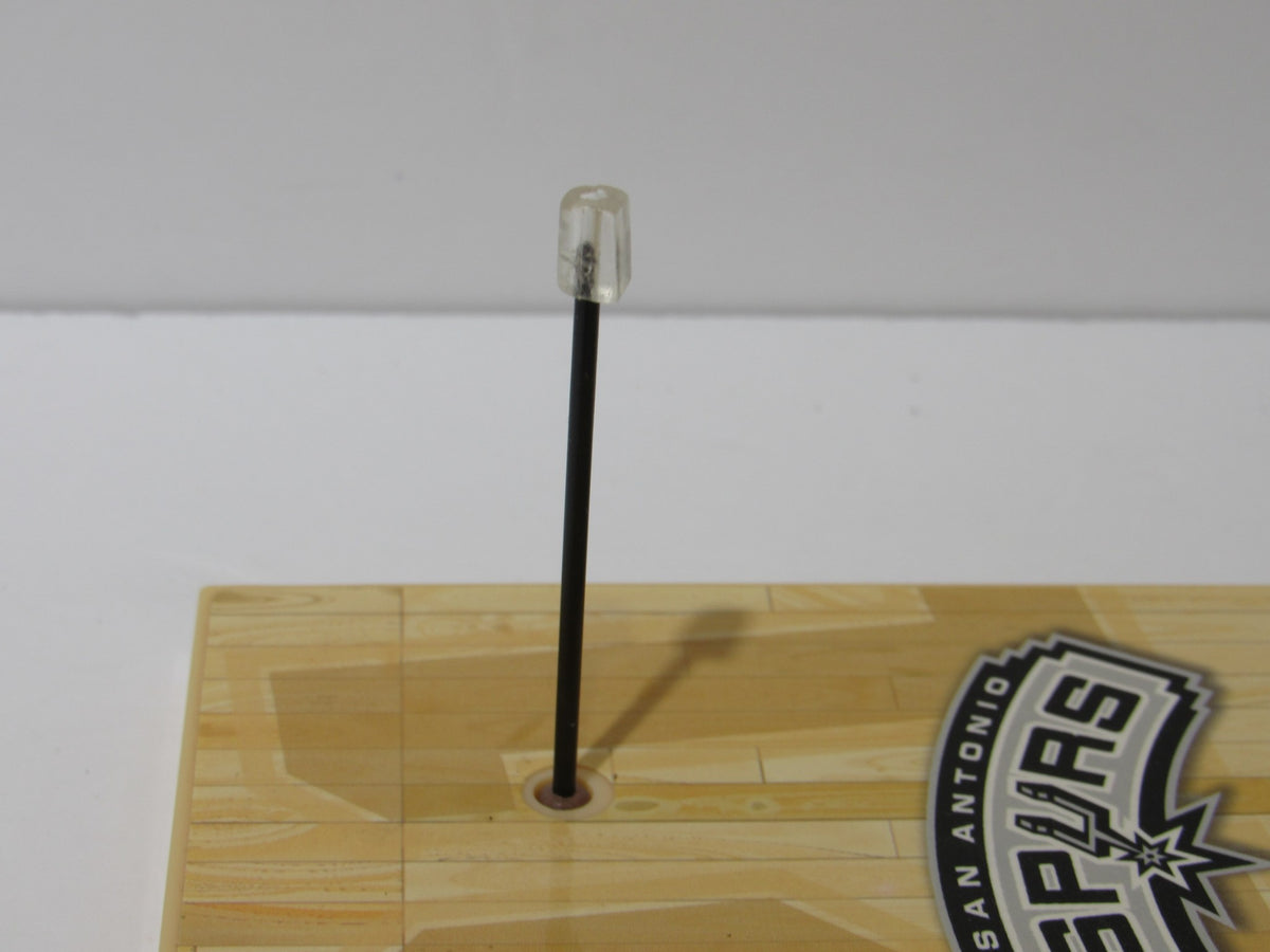 Close-up of the display base for McFarlane NBA Series 6 Loose Figure: Tim Duncan with a clear support peg.