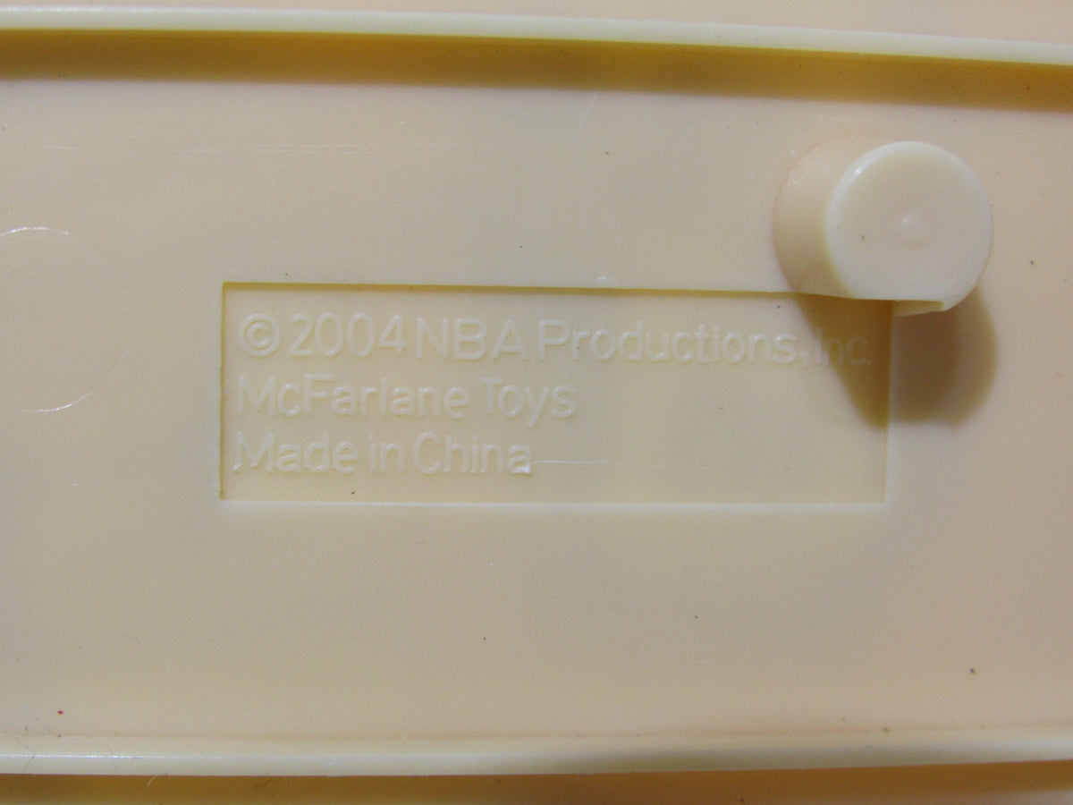 Underneath view of the McFarlane NBA Series 6 Loose Figure: Tim Duncan showing details including production information.