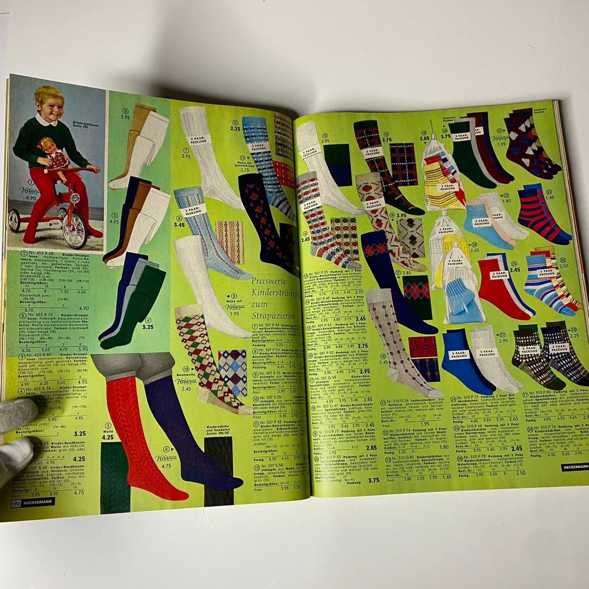 1965 Neckermann Summer Catalog displaying a variety of children's and adult's socks with colorful patterns and styles, illustrating mid-century fashion.